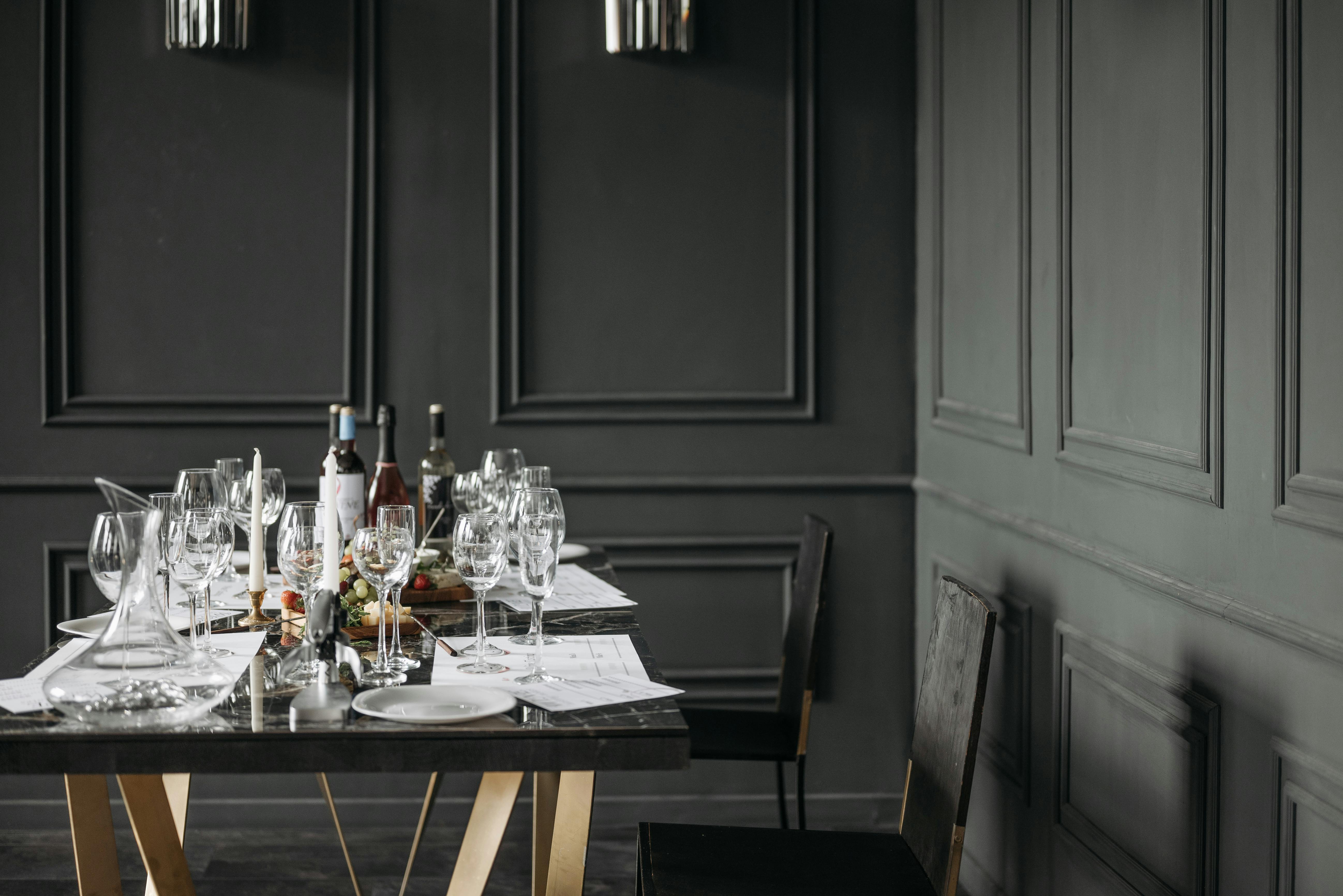 A Table with Wine Glasses and Wine Bottles