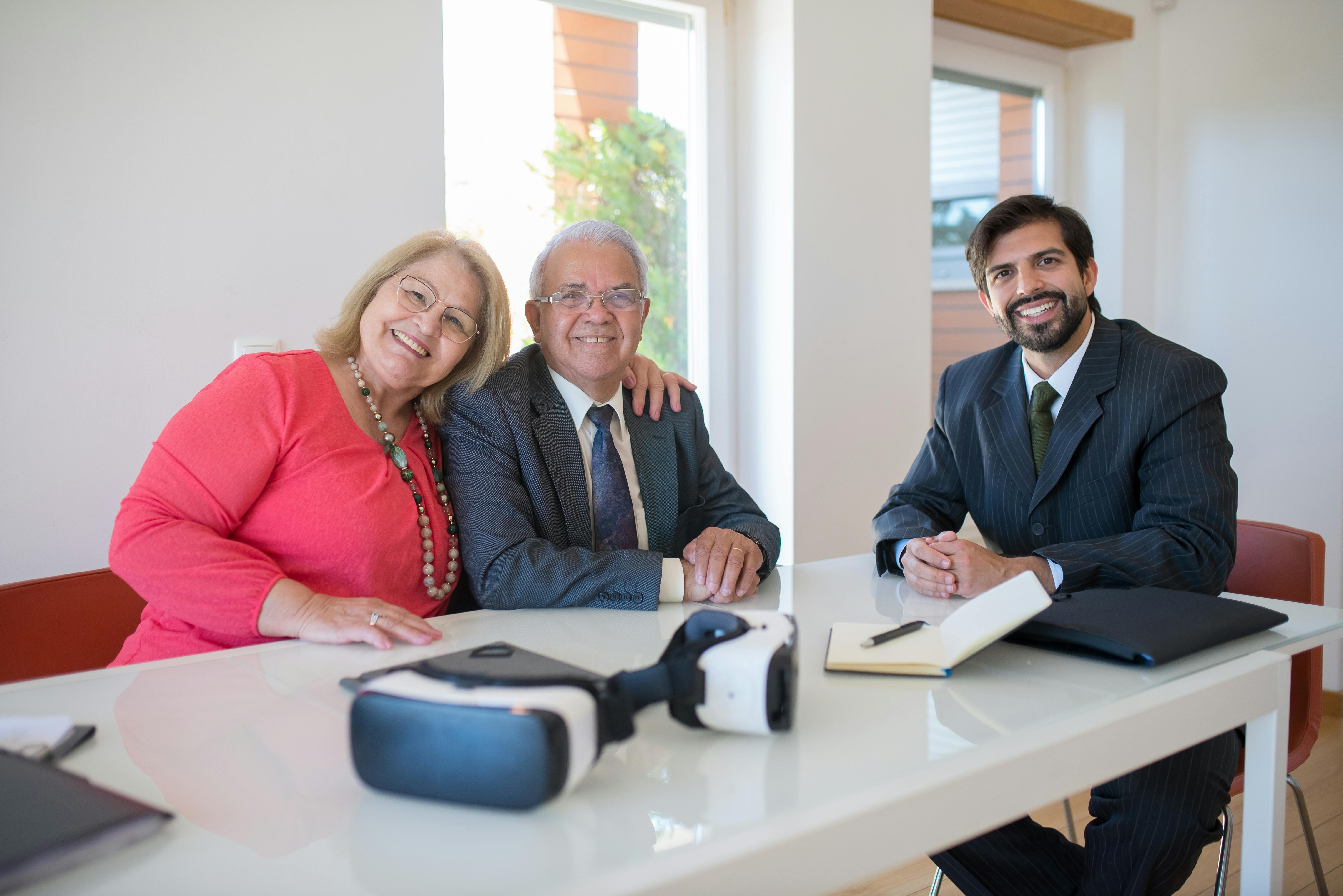 Couple Sitting Beside a Businessman