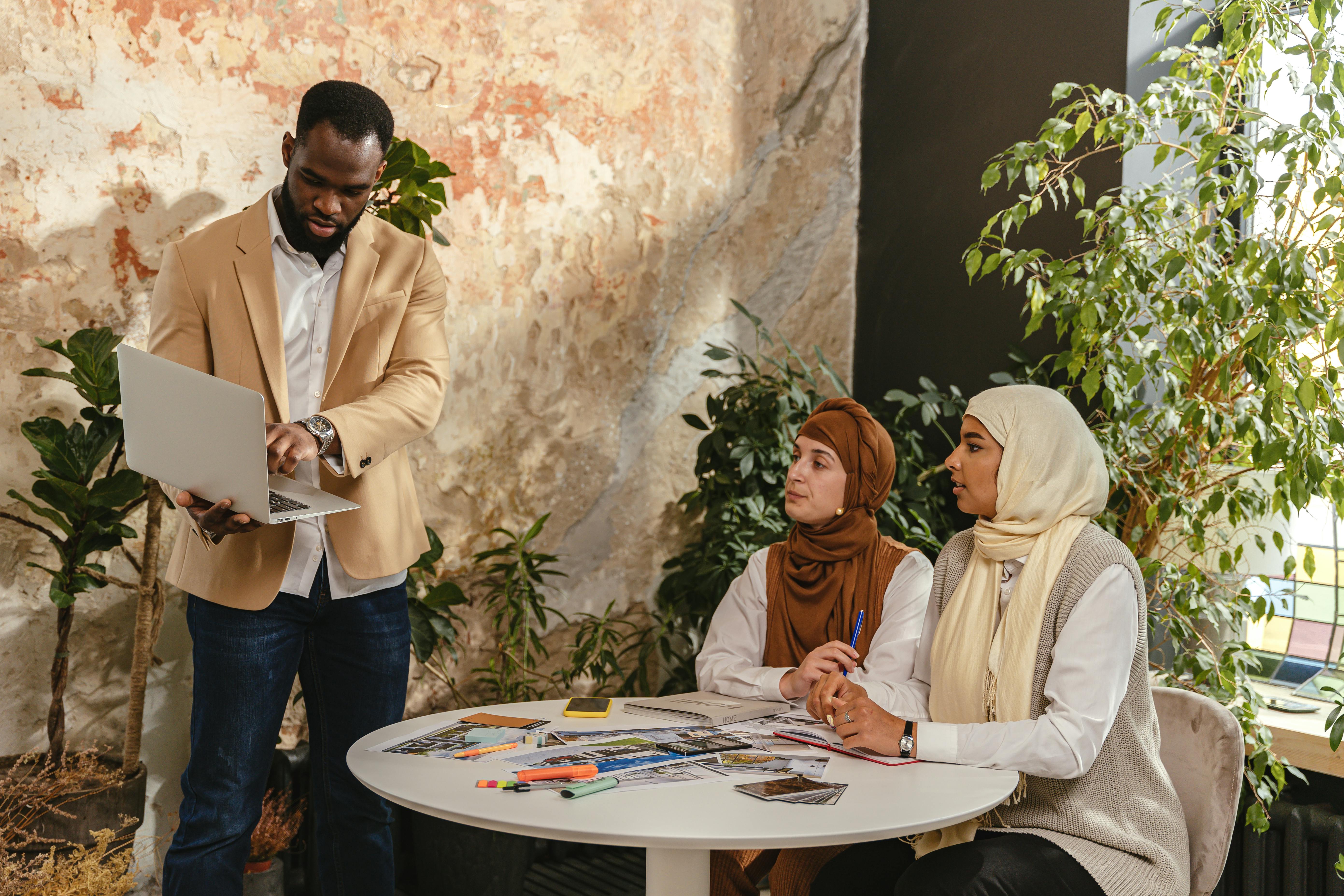 A Man Making a Business Presentation to Women