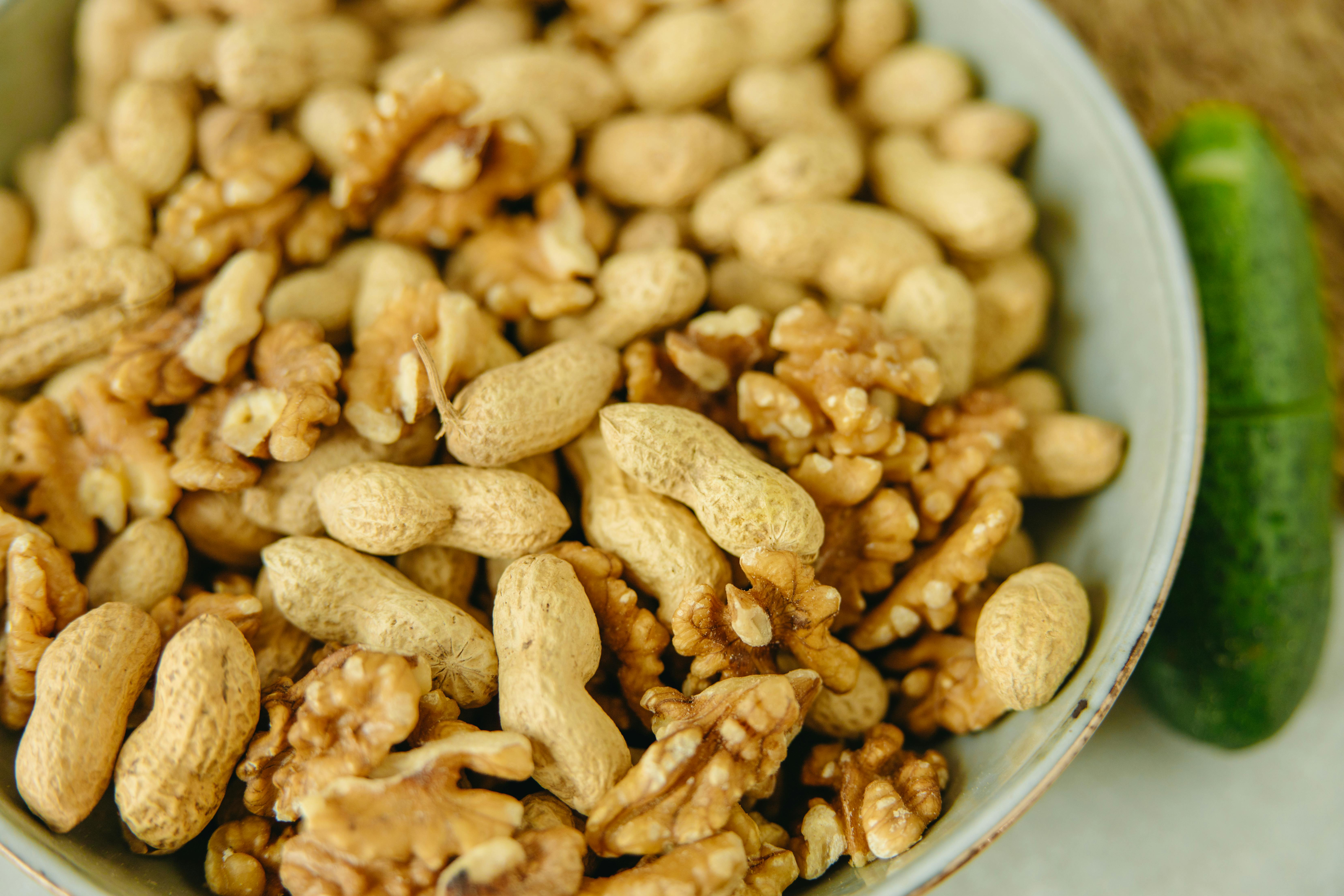 Brown Peanuts in White Ceramic Bowl