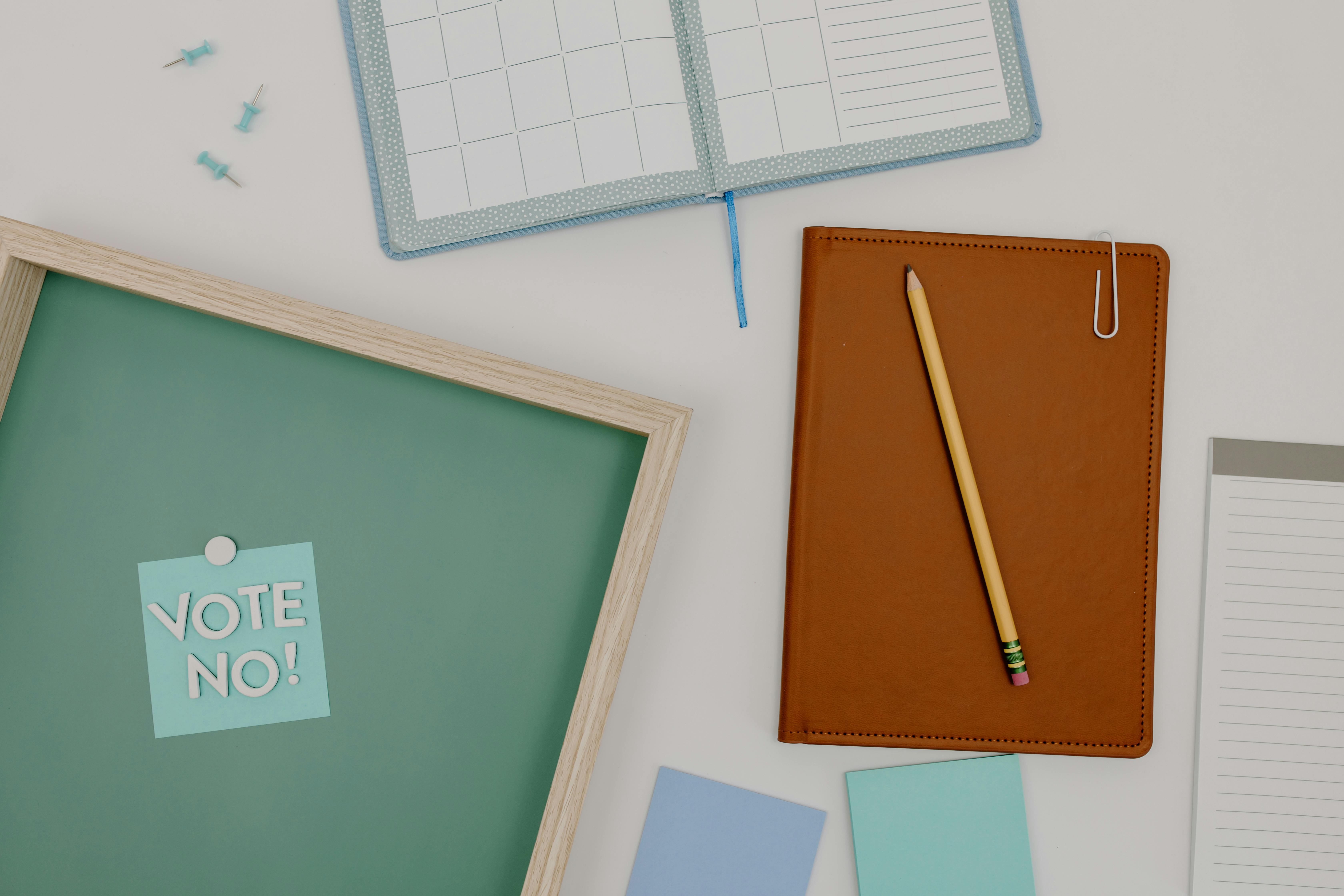 Assorted Office Supplies on White Surface