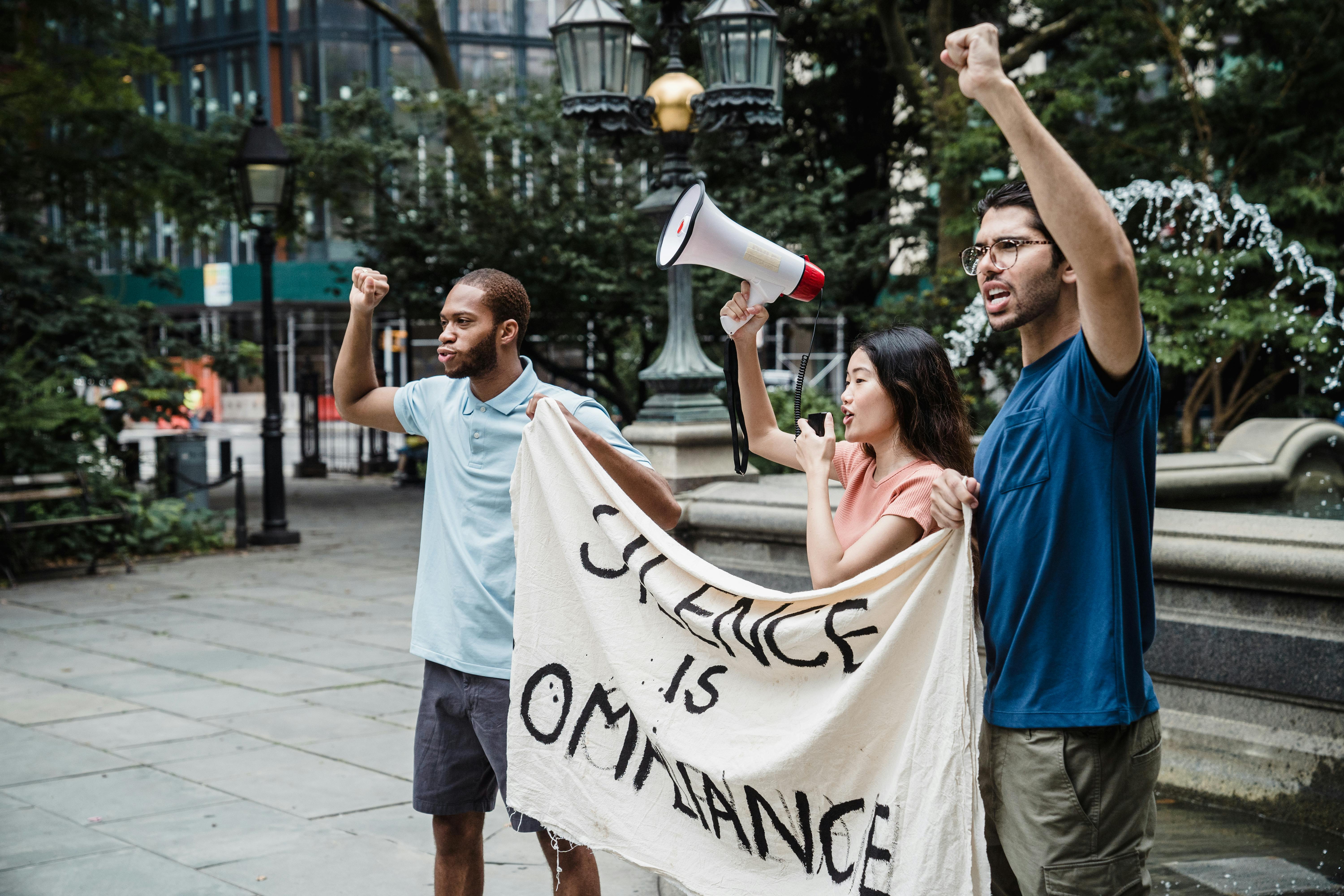 Protesters protesting in front of a Water Fountain