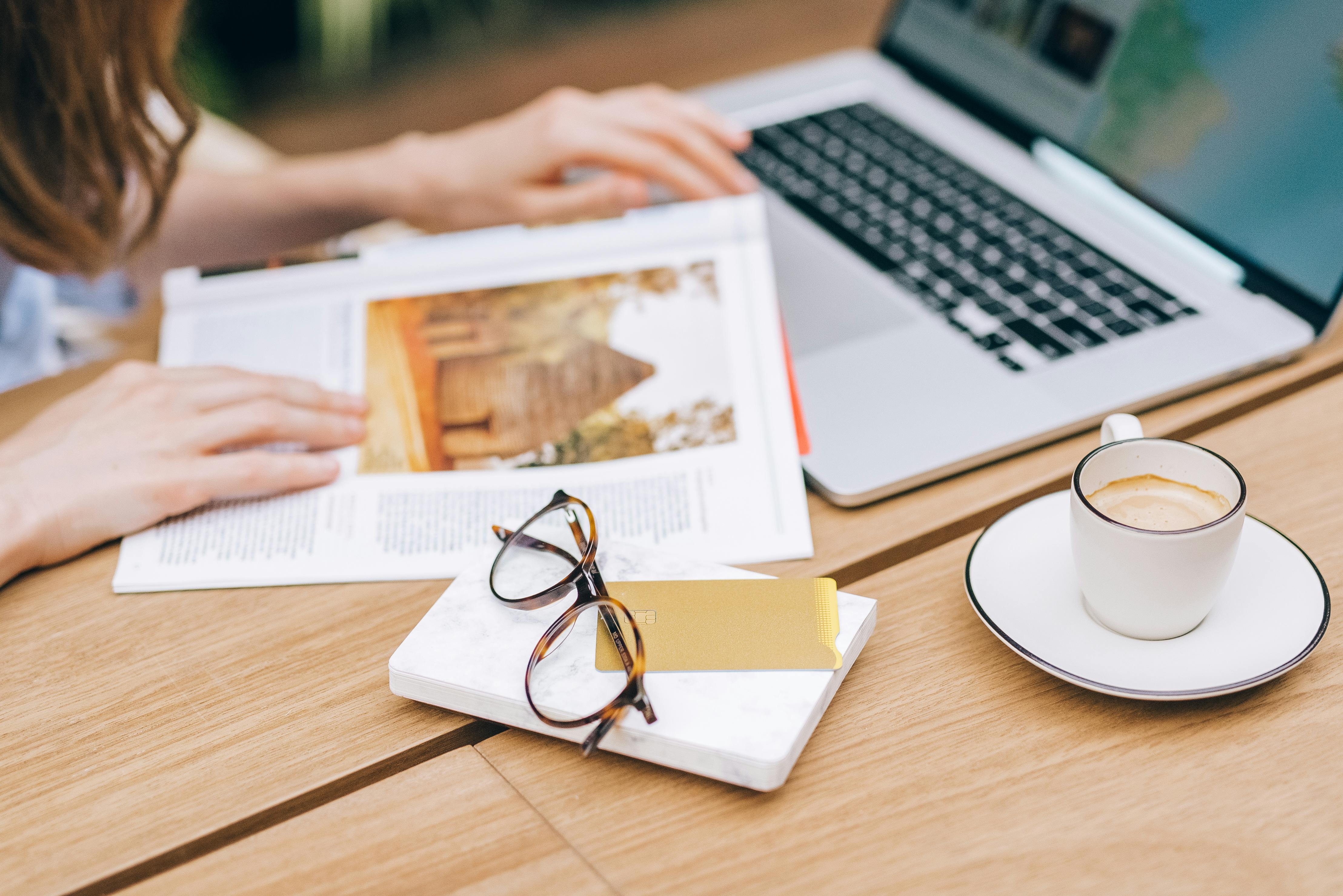 Eyeglasses and Cup of Coffee on the Table