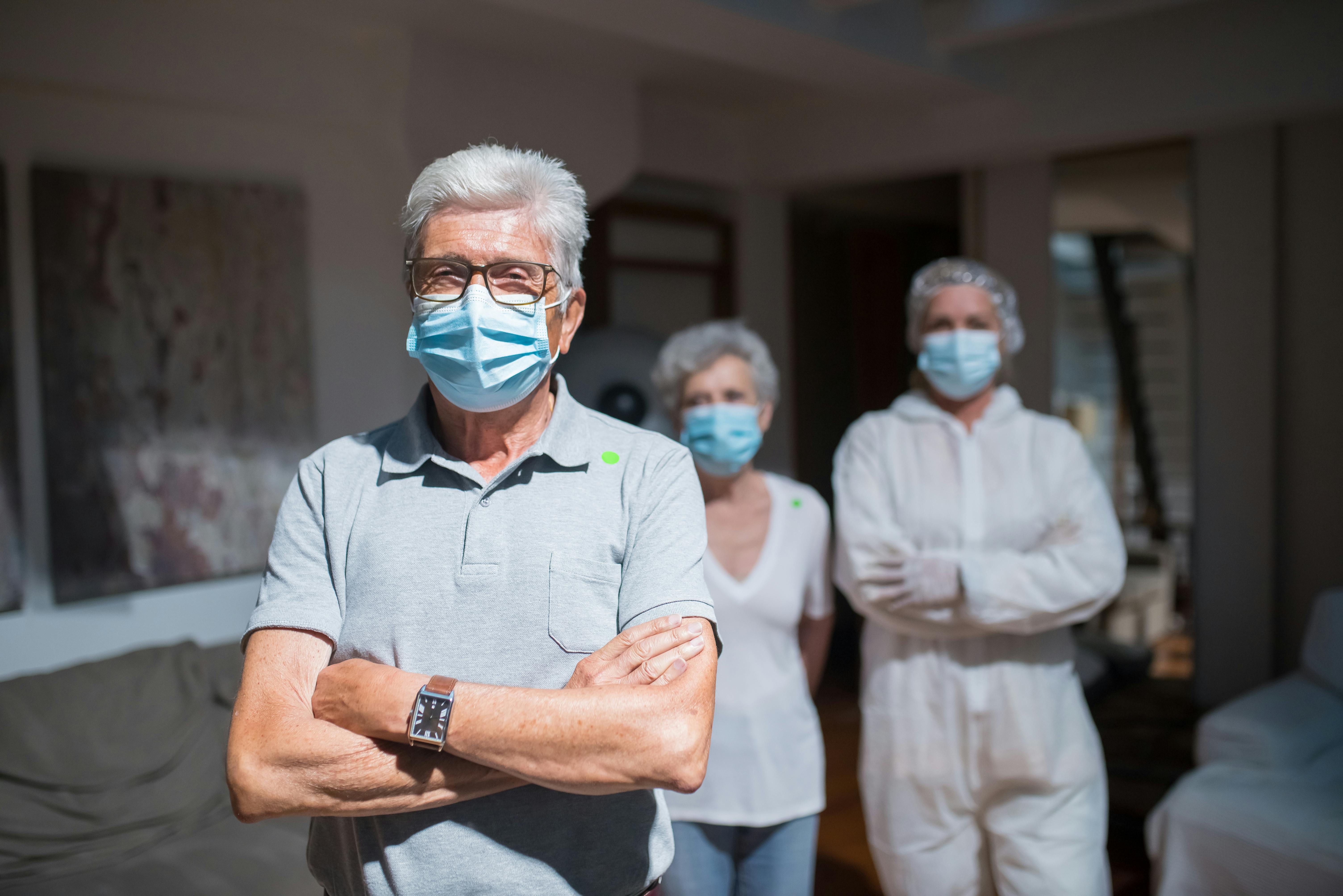 Elderly Man Wearing a Face Mask with His Arms Crossed