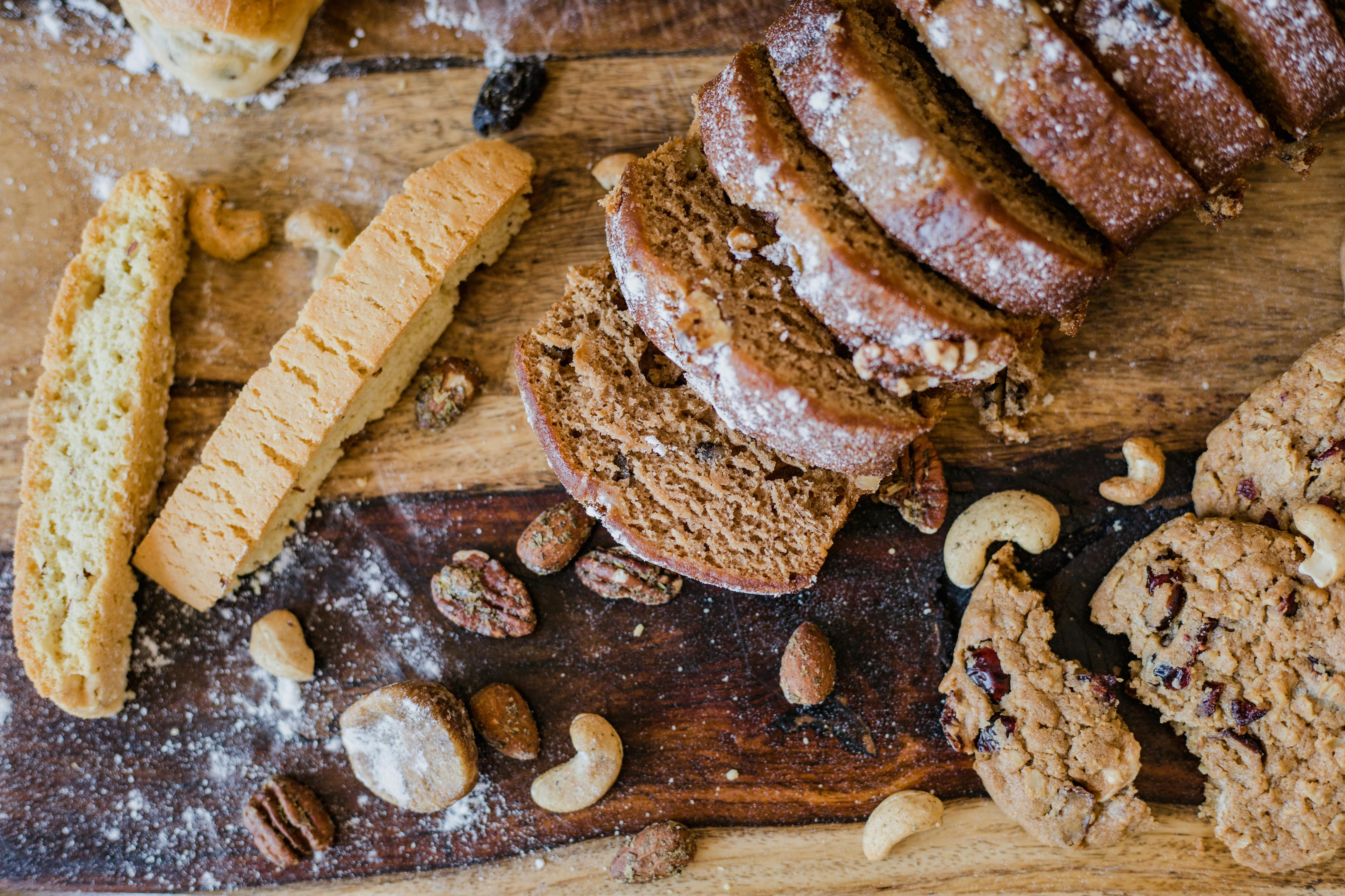 Baked Goods and Nuts on a Wooden Board