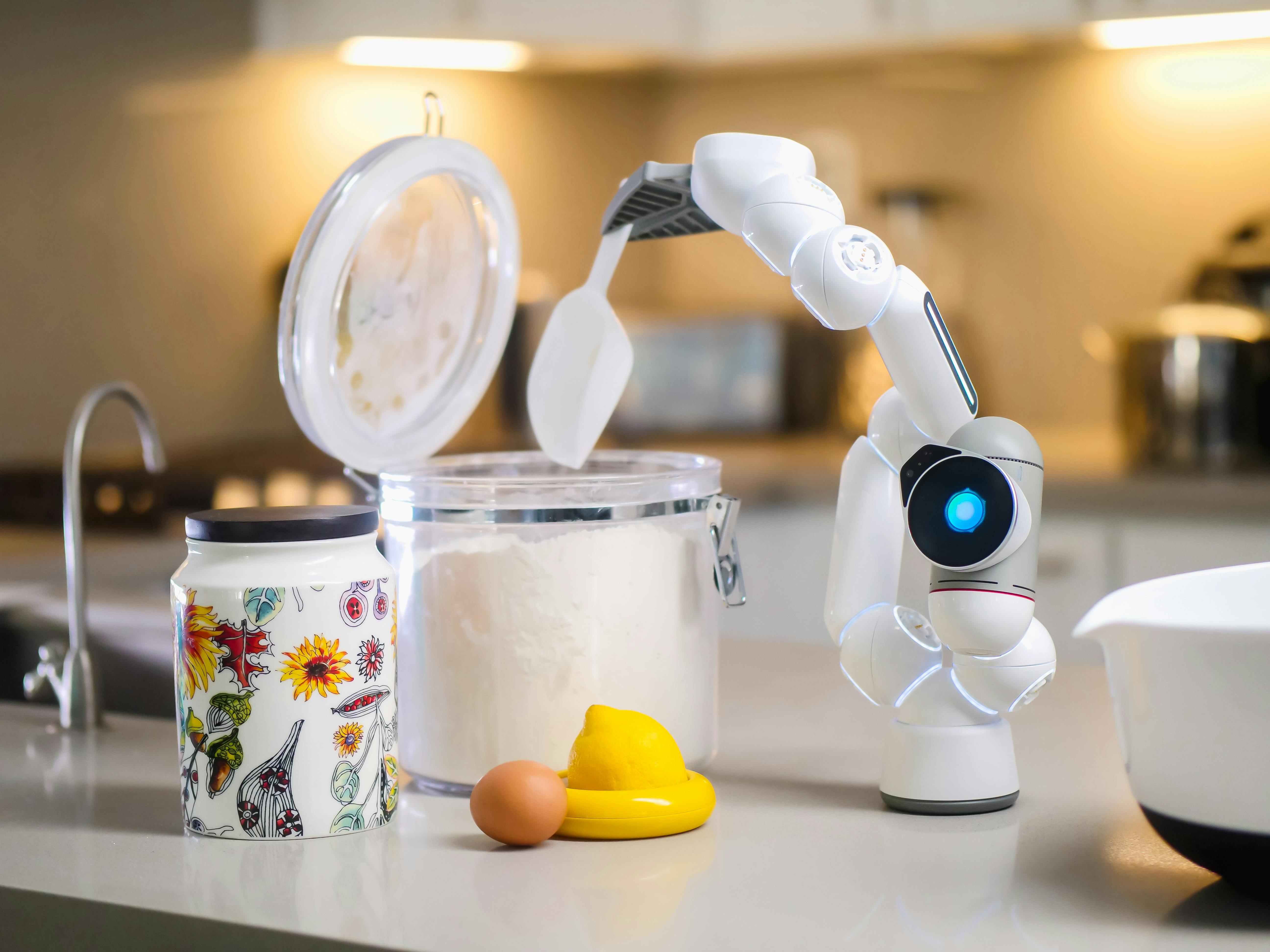 White and Gray Robot Toy Beside Clear Glass Jar With White Powder