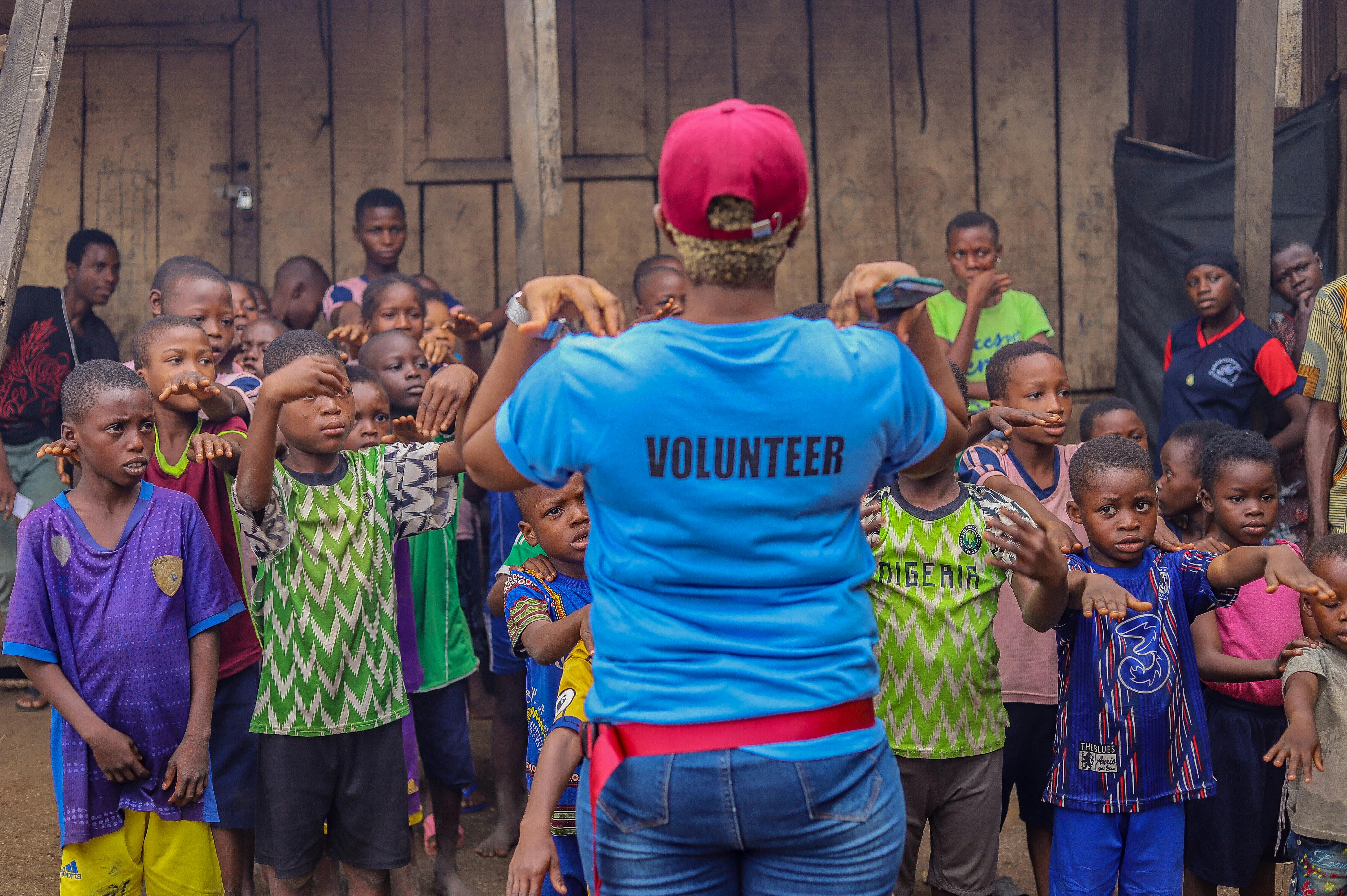 A Volunteer Giving Charity to Children