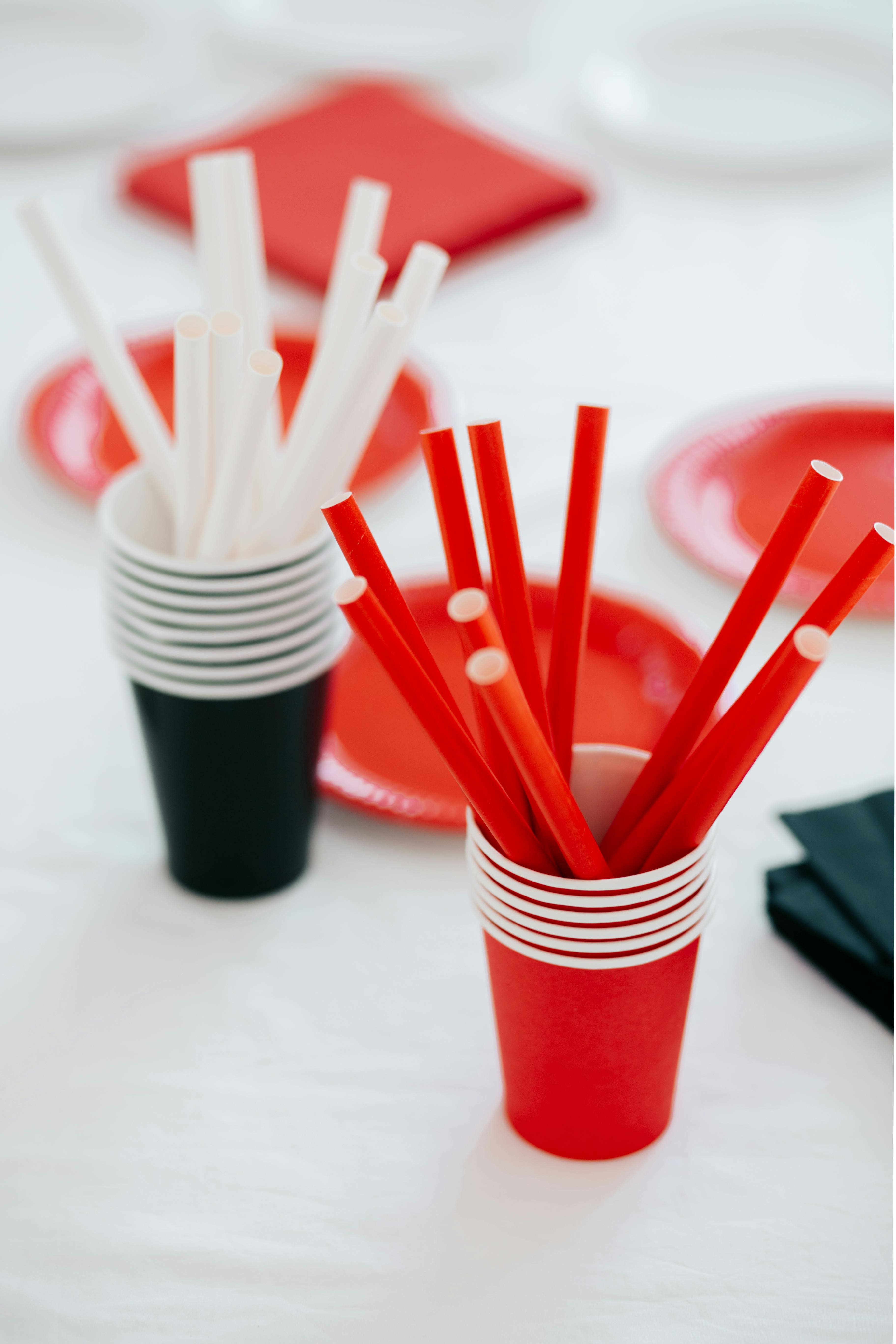 A Disposable Cups with Drinking Straws on the Table