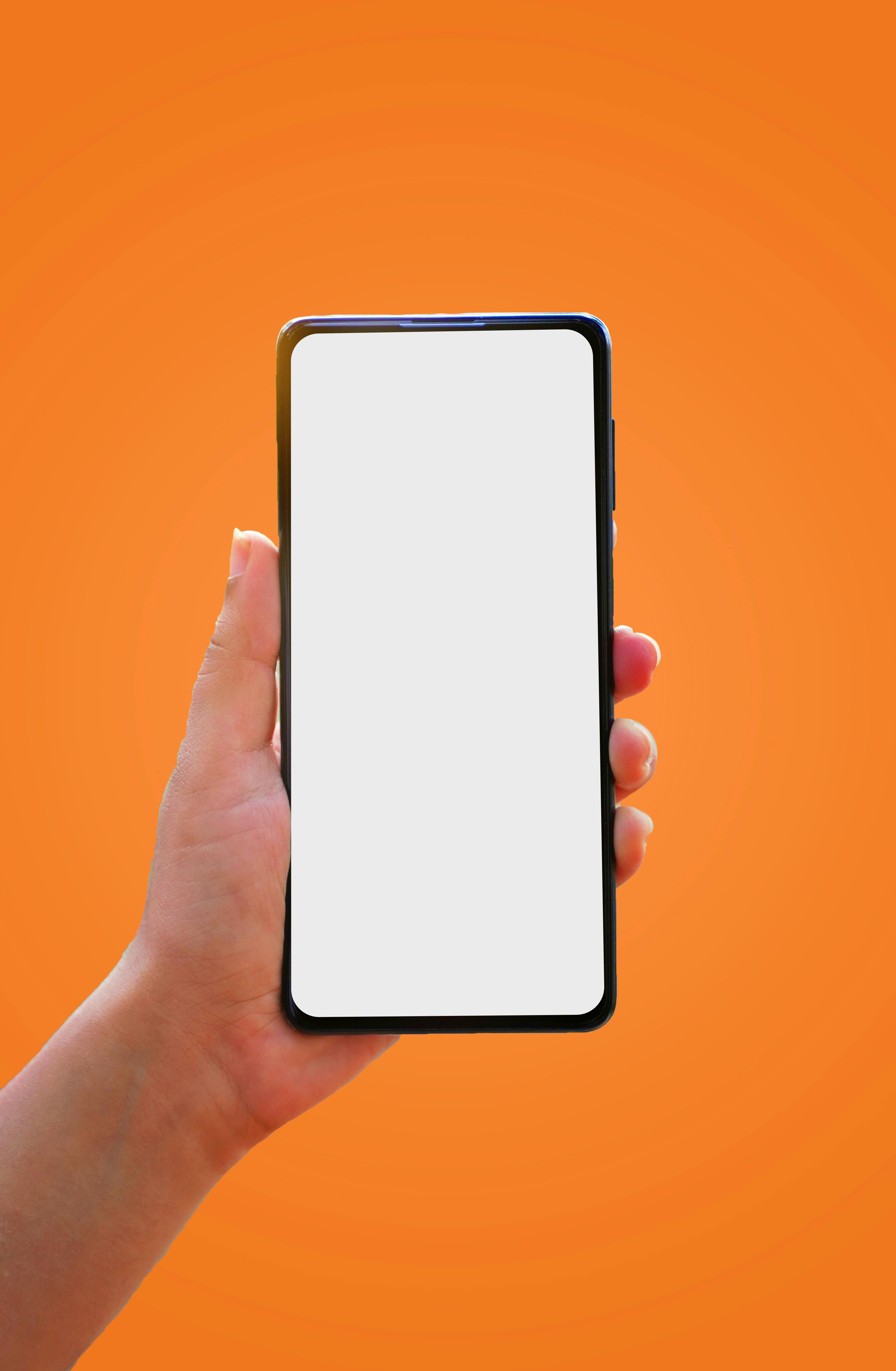 Person Holding Mobile Phone with Empty Screen 