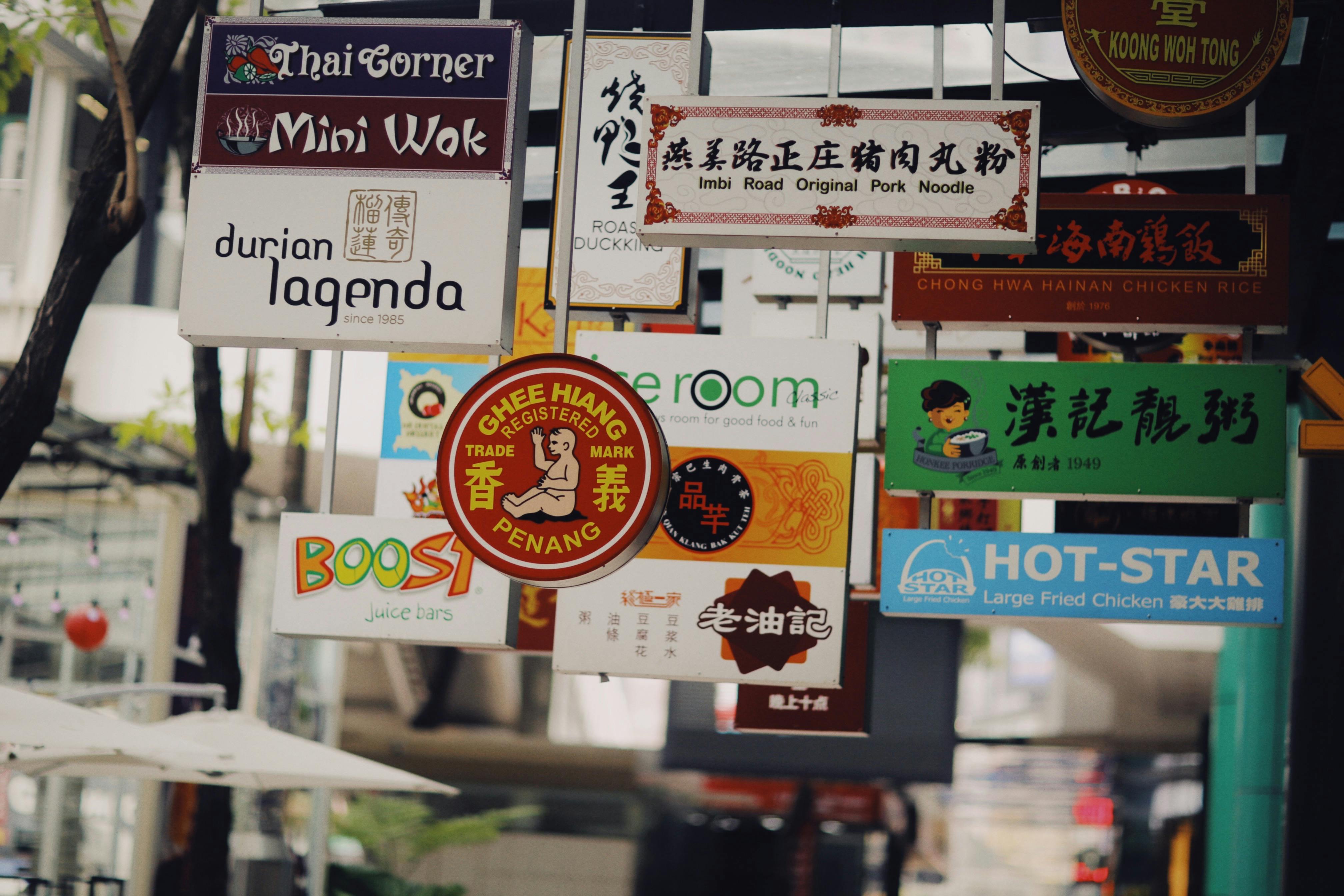 Numerous Shop Signs on Street in Asia