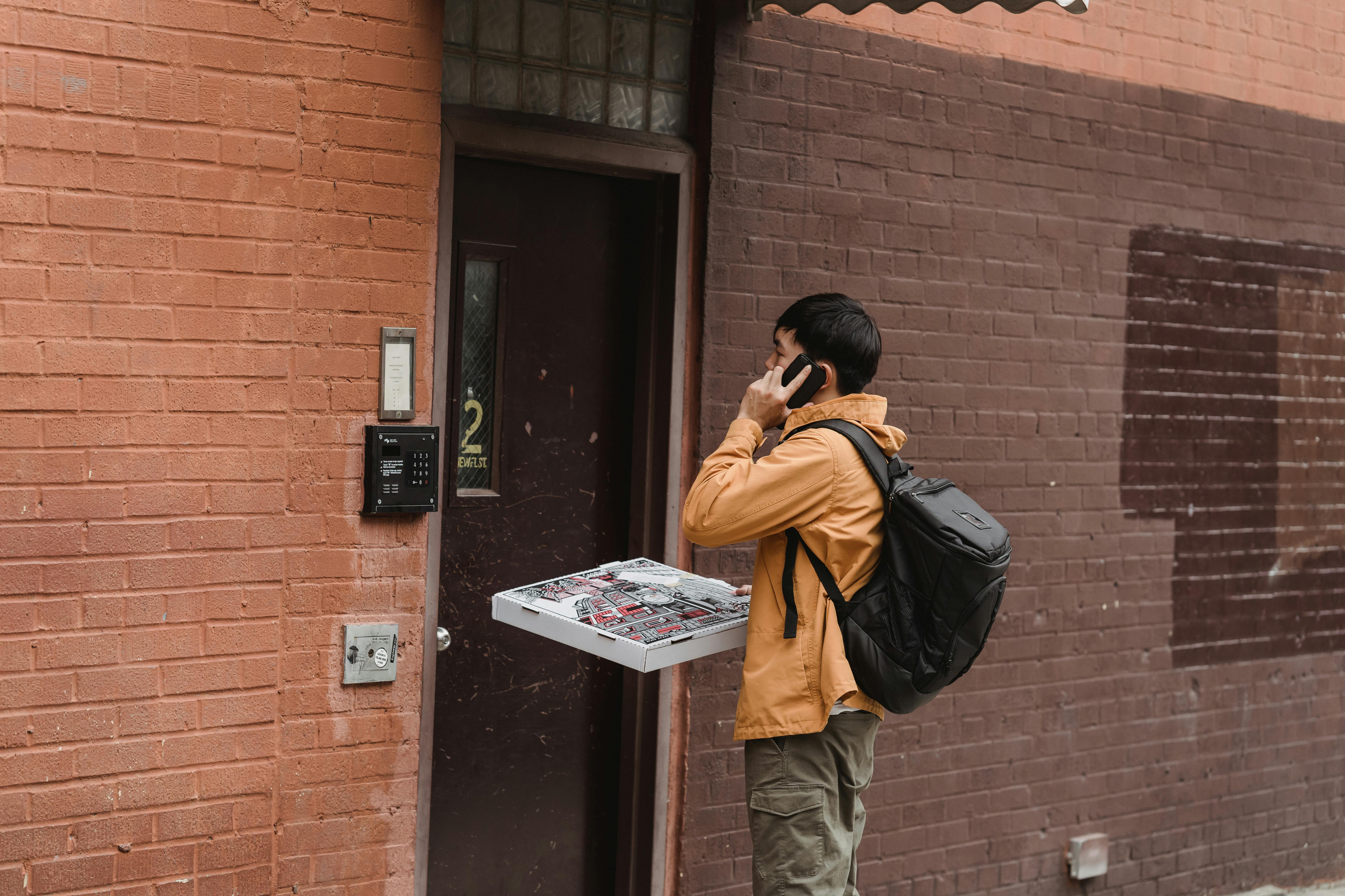 Man Standing Beside a Door