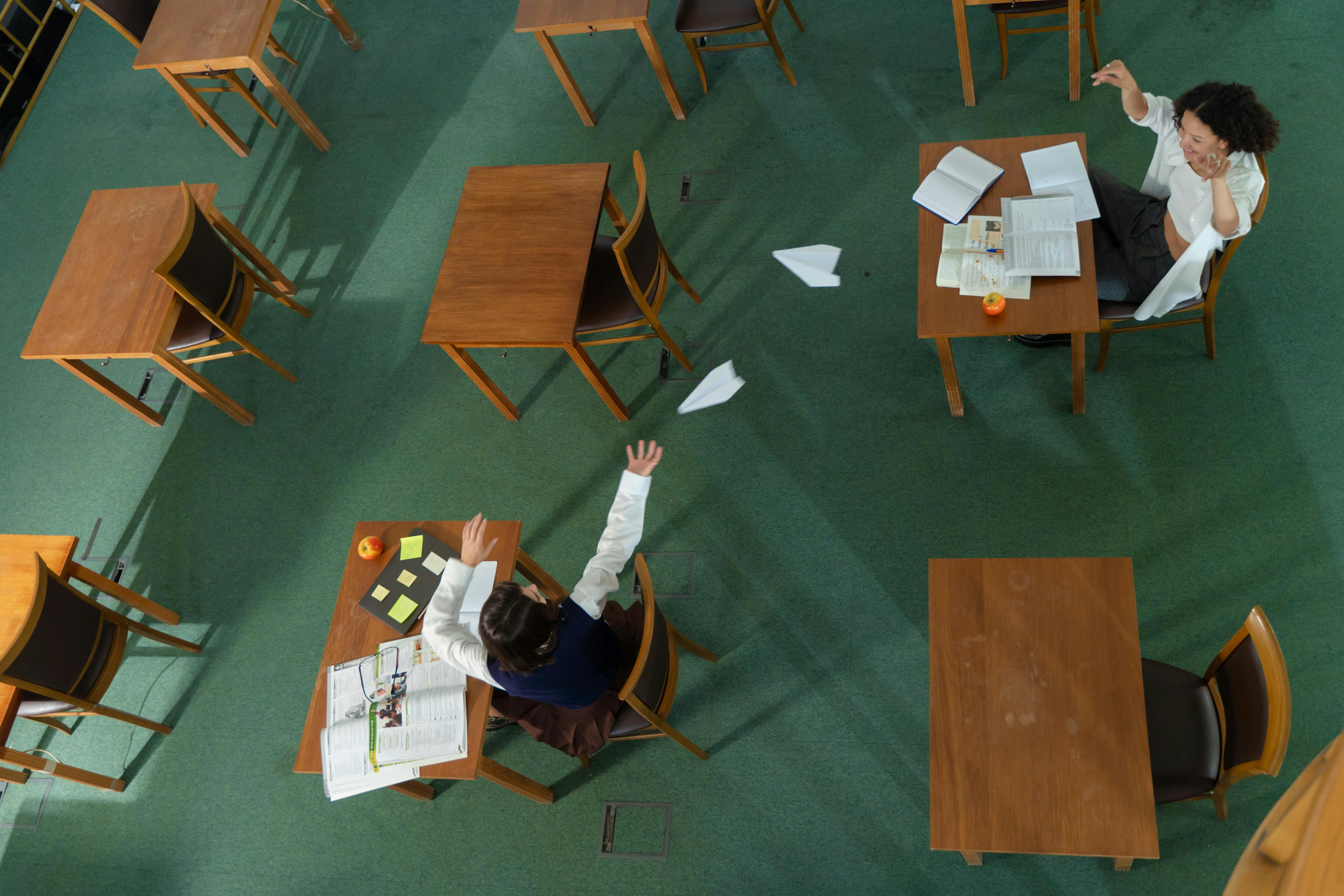 Students Flying Paper Planes inside a Classroom