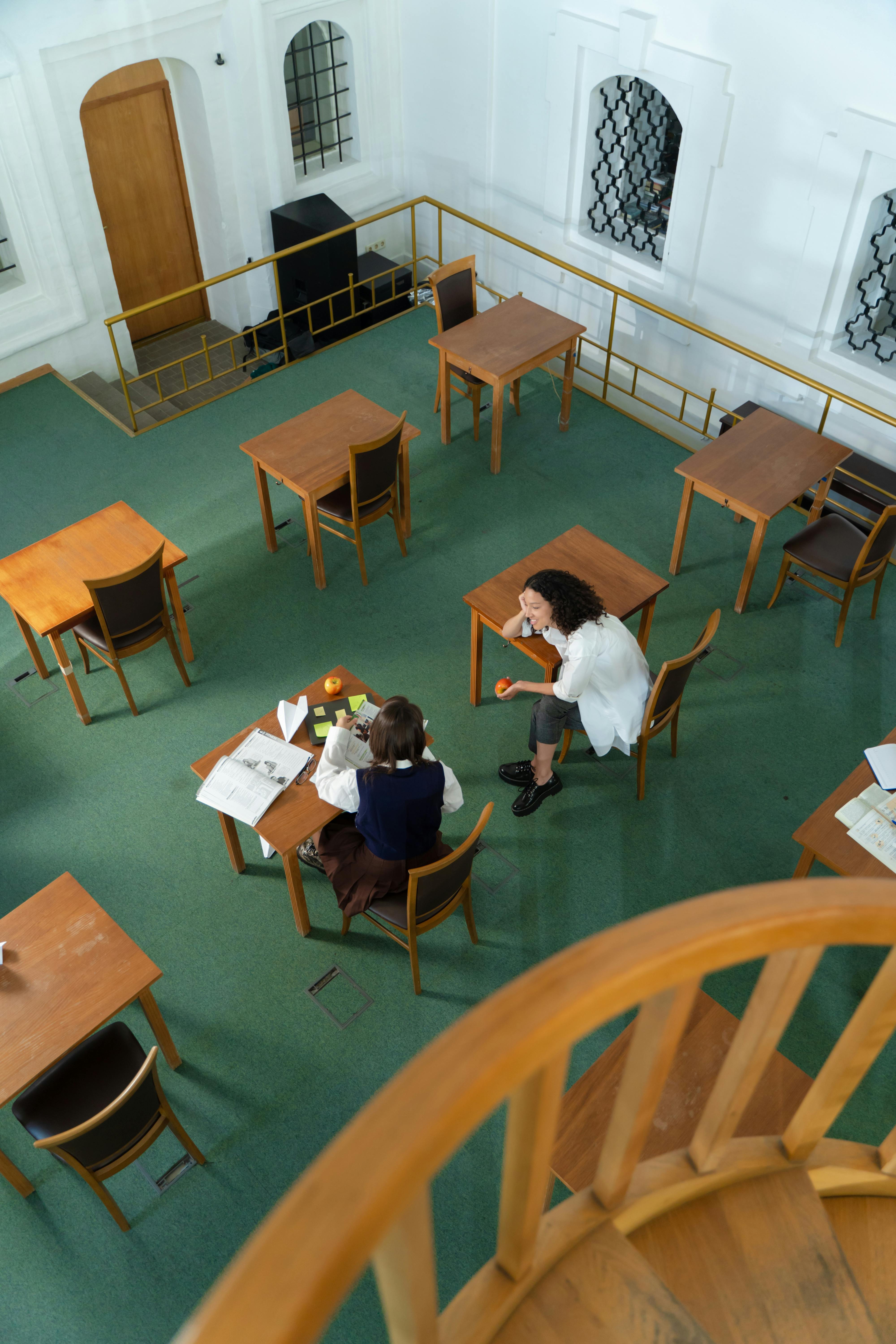 Women Sitting at a Library