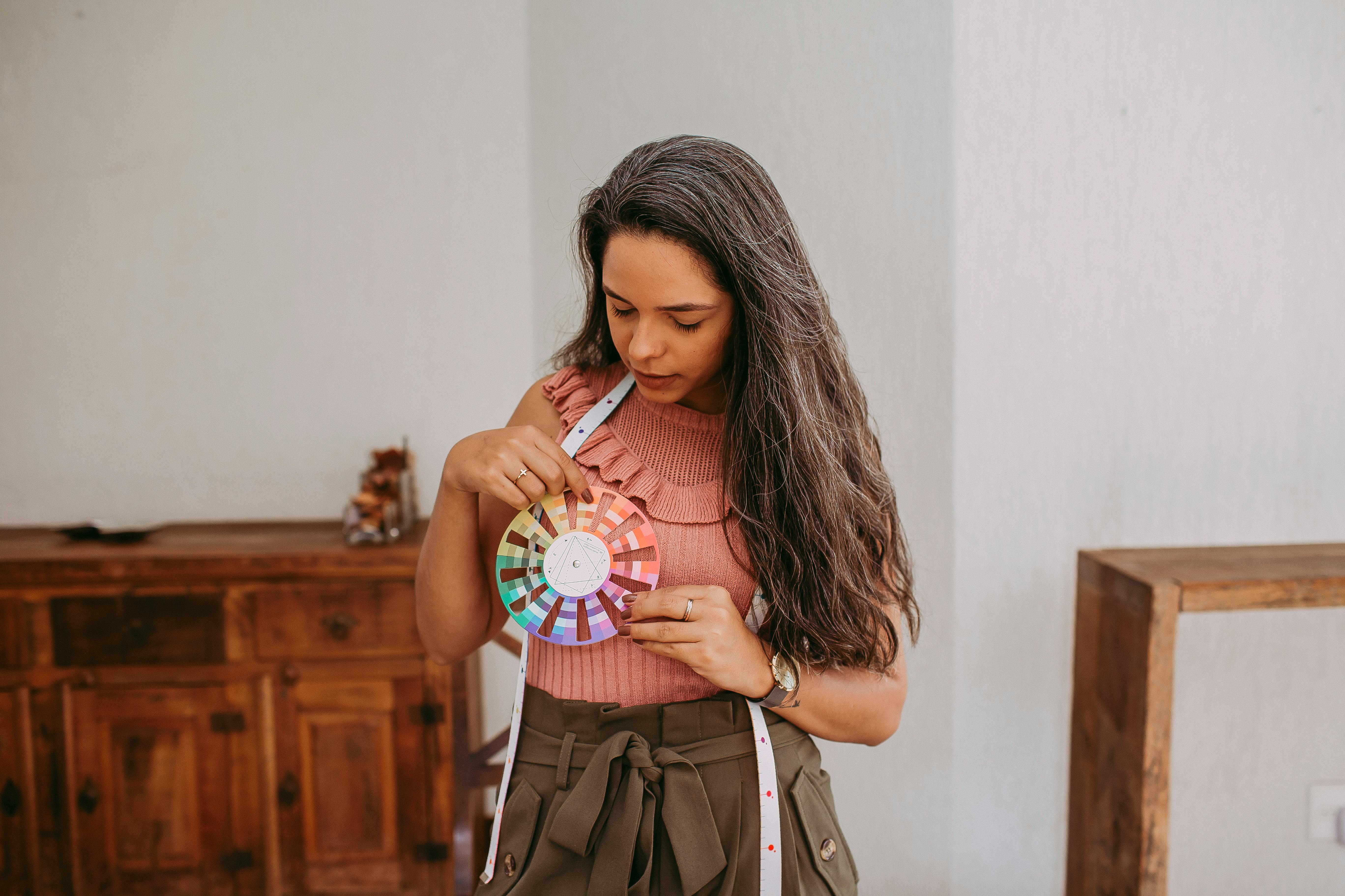 A Fashion Designer Holding a Color Wheel