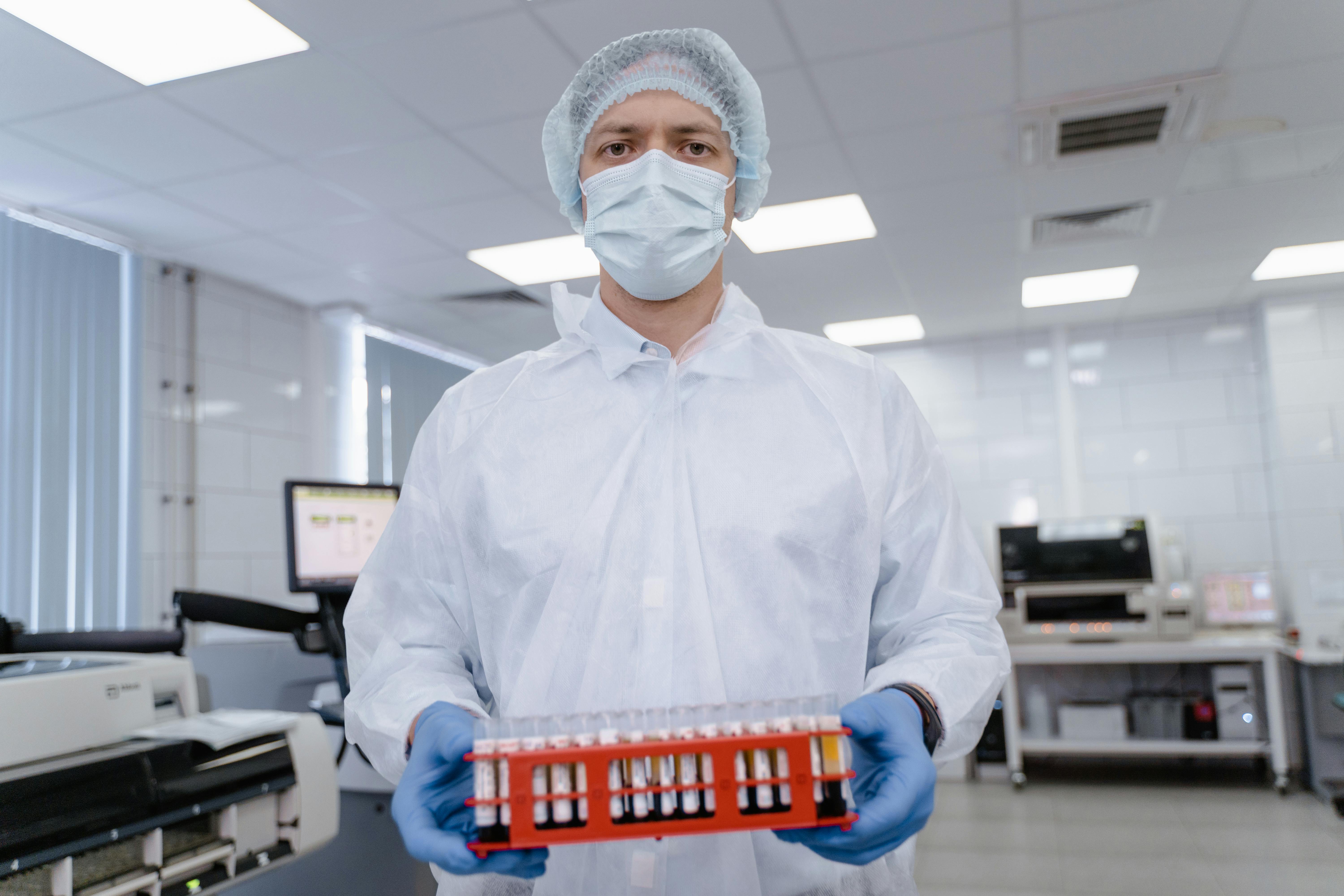 A Man Holding a Test Tube Rack