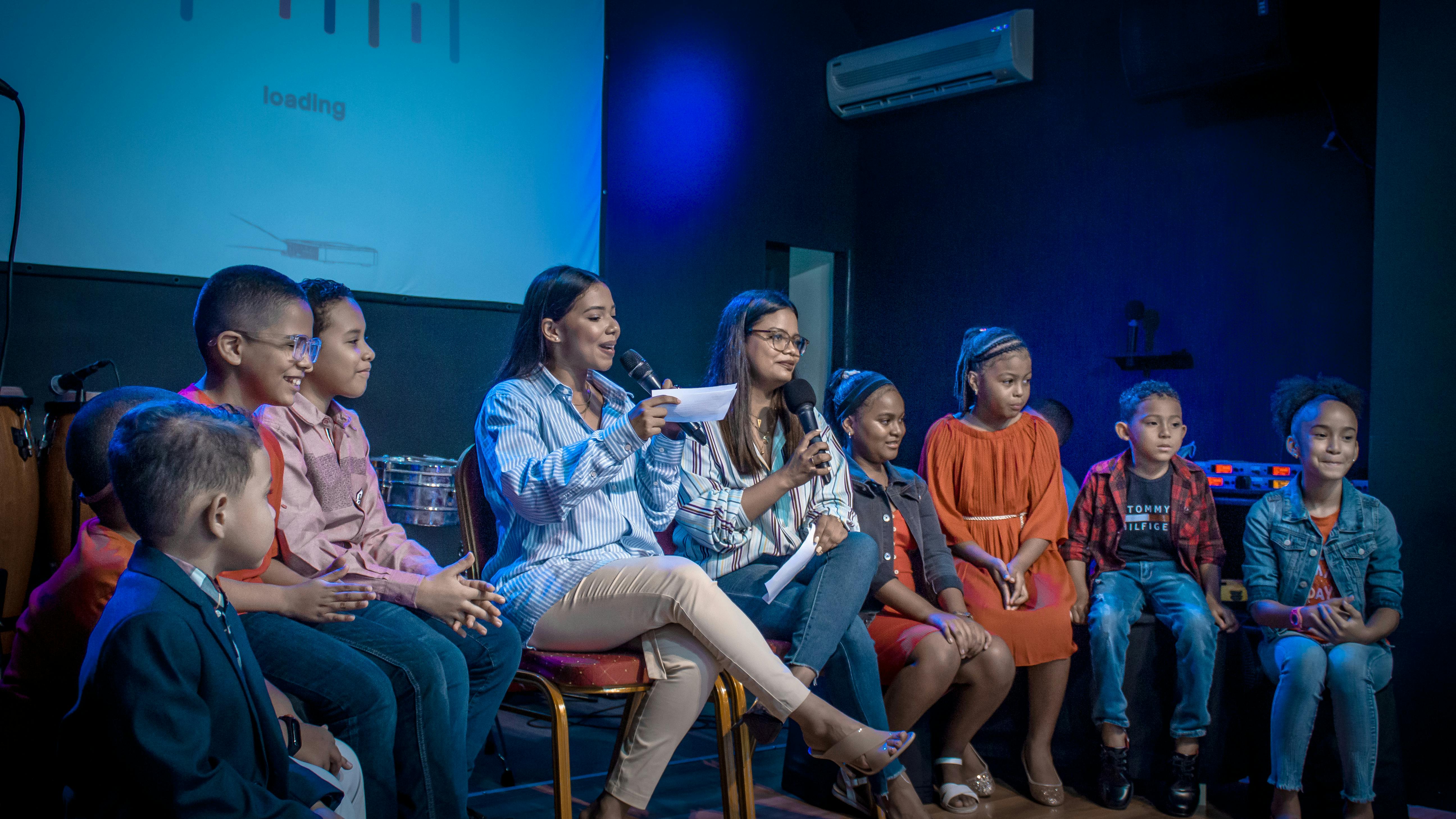 Women Sitting with Children