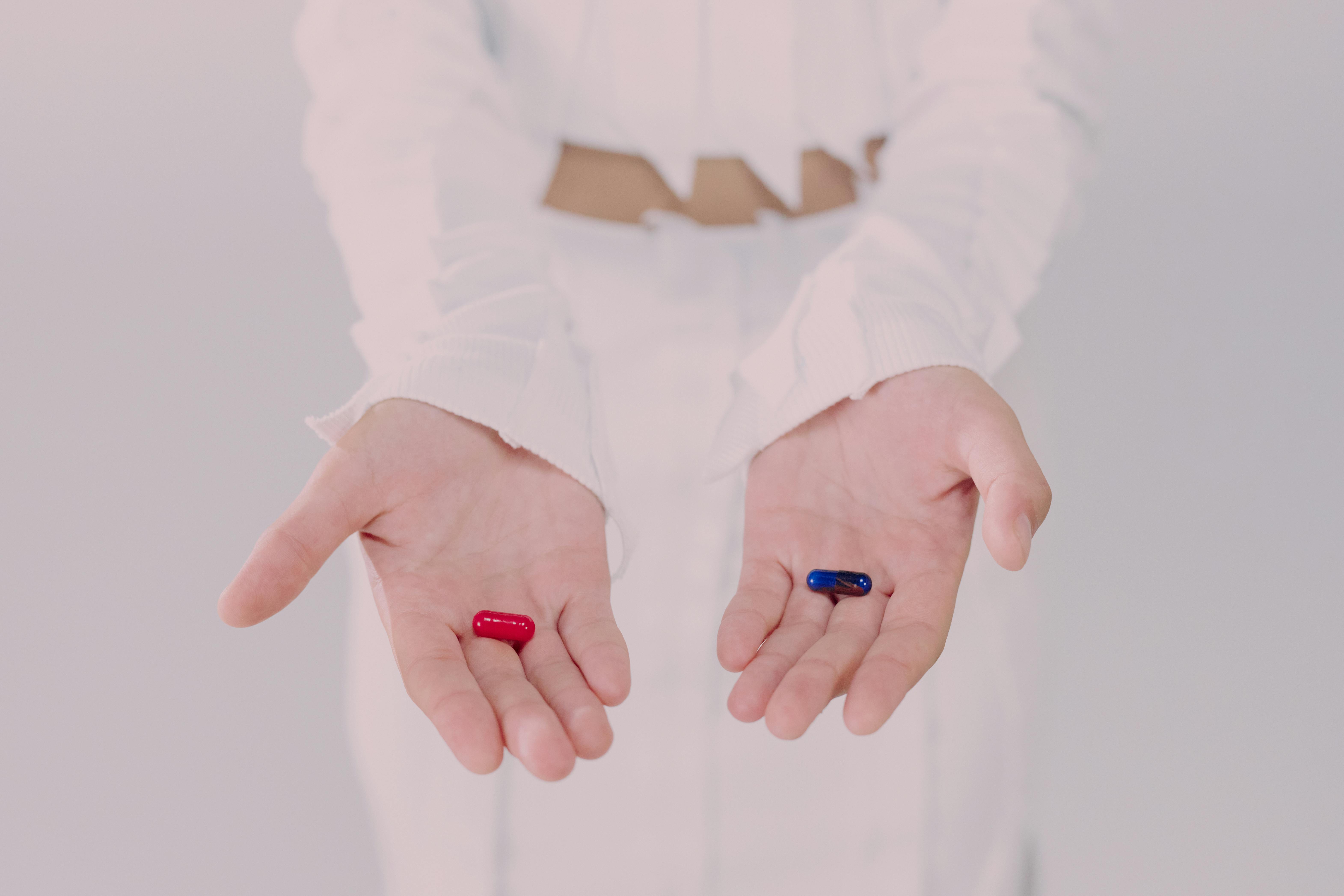 Woman holding pills