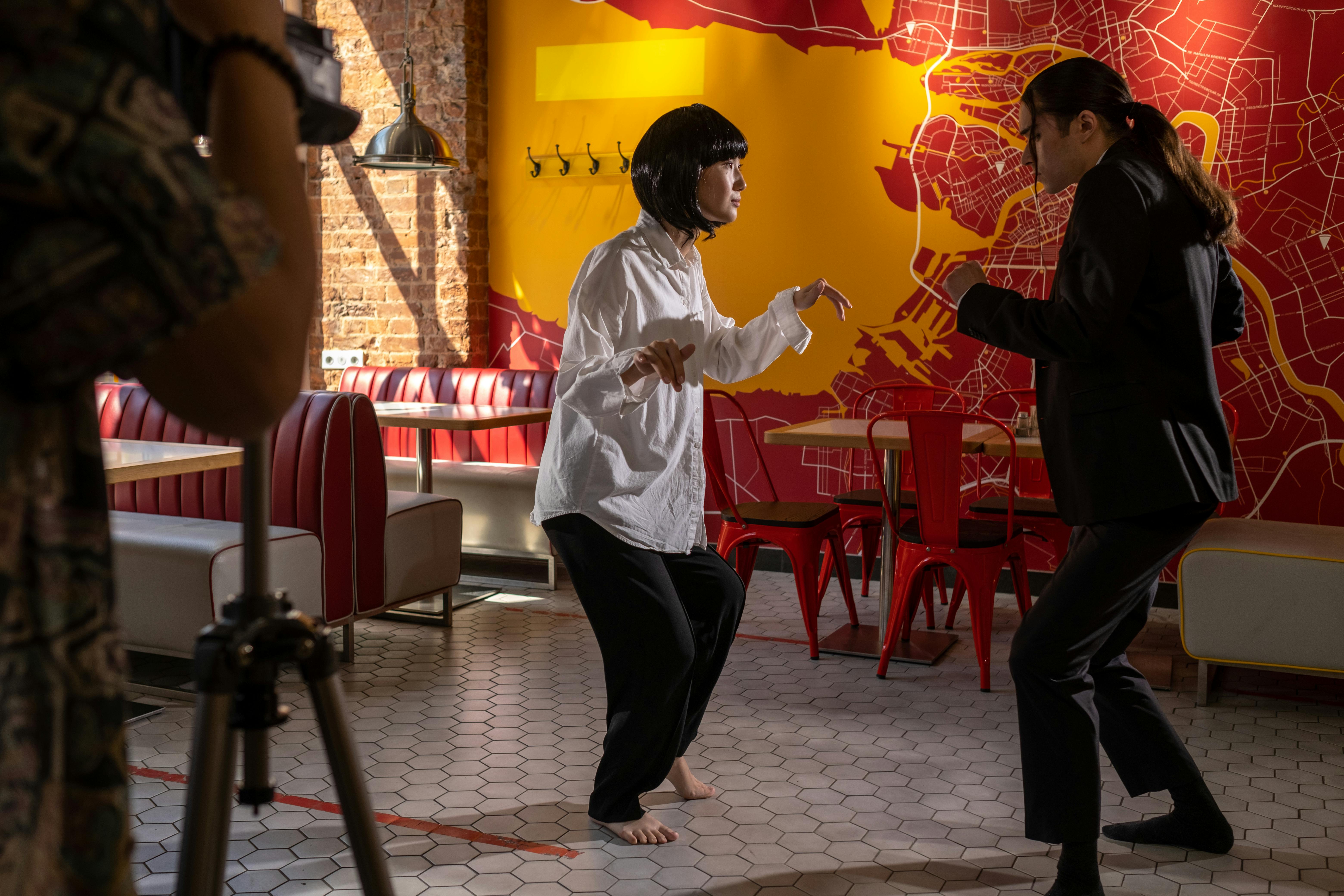 A Man and Woman Dancing Inside the Café