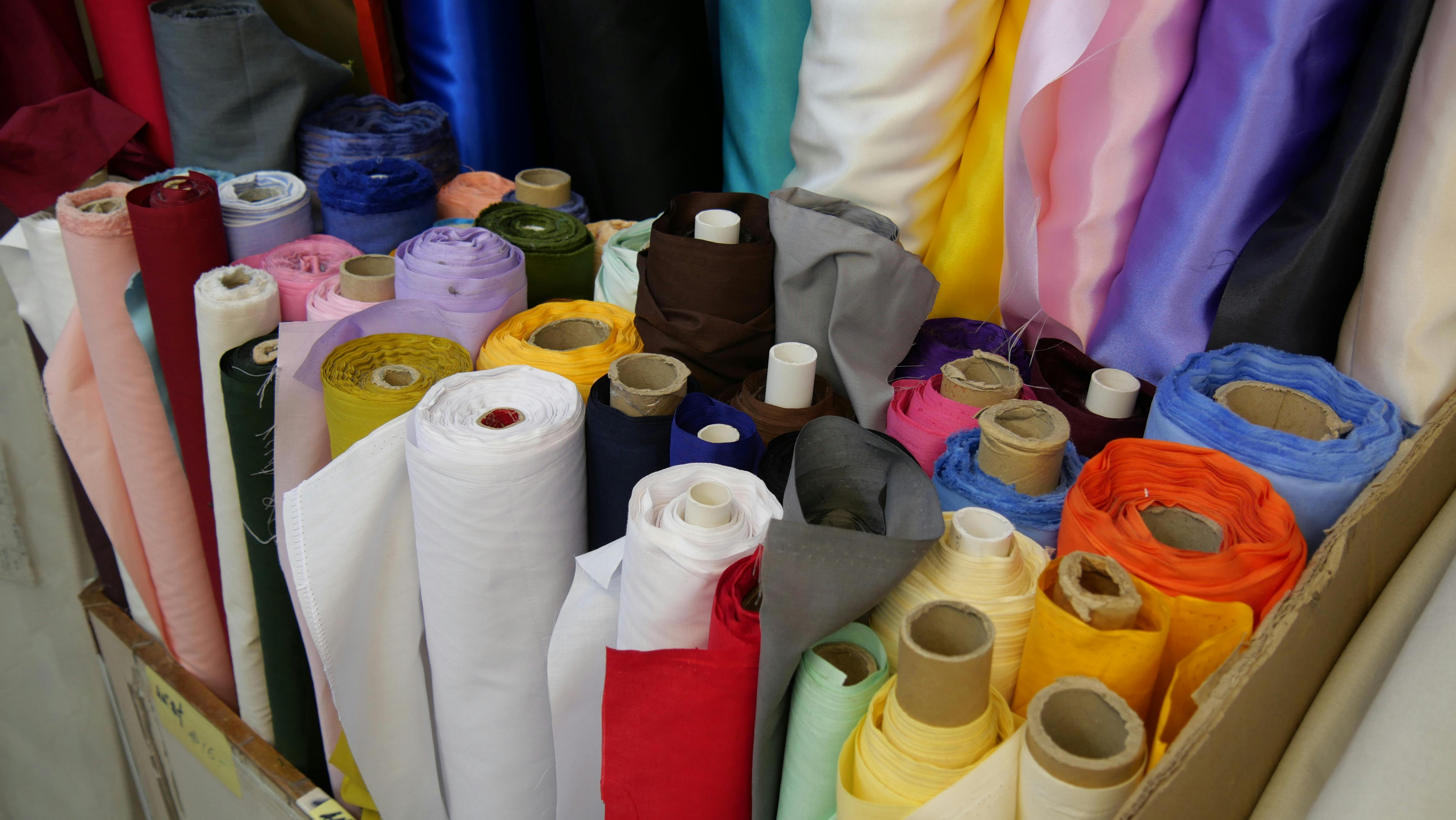 Close-Up Shot of Assorted Rolled Textiles