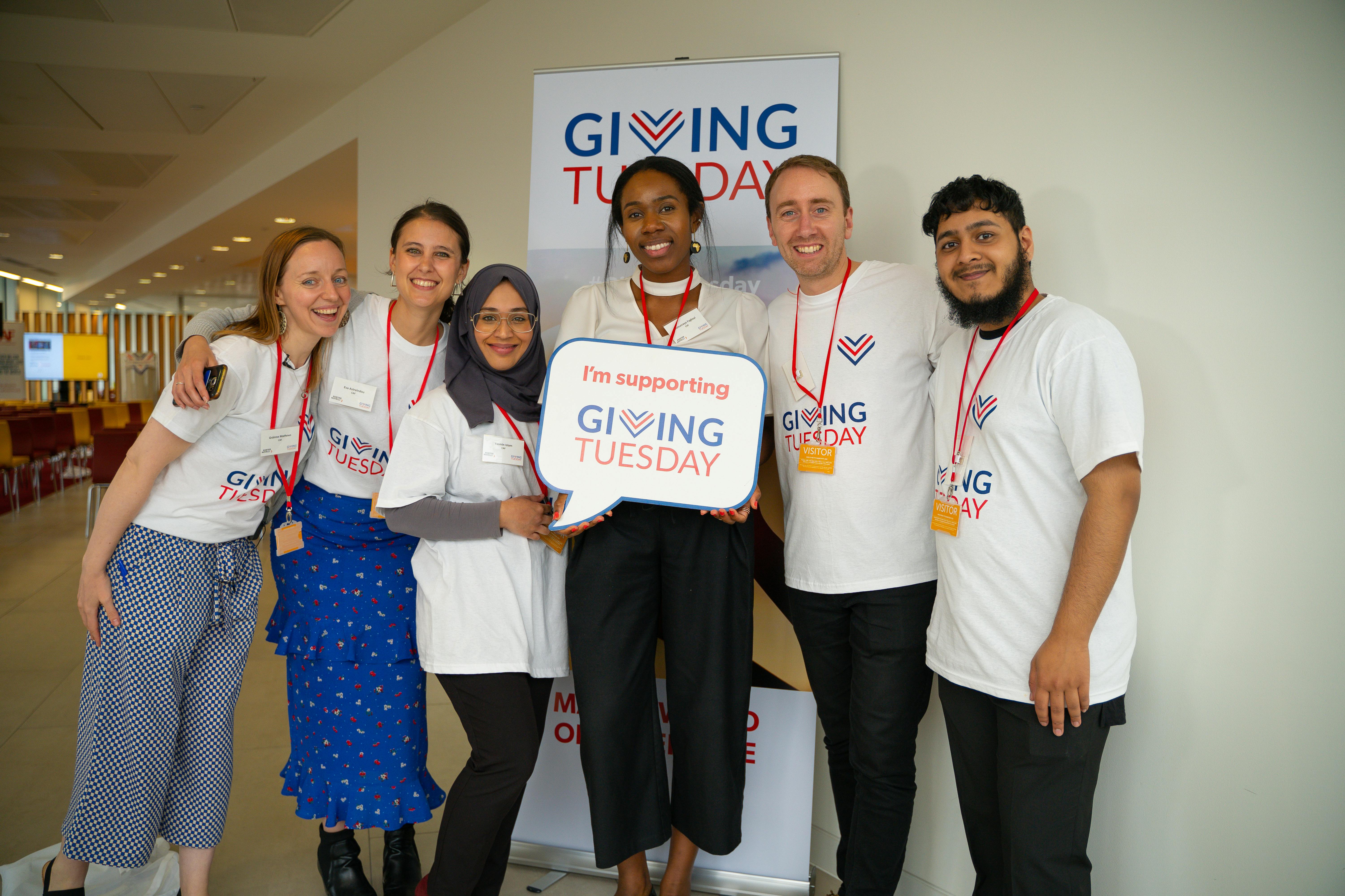 A group of activists posing to a picture at an event