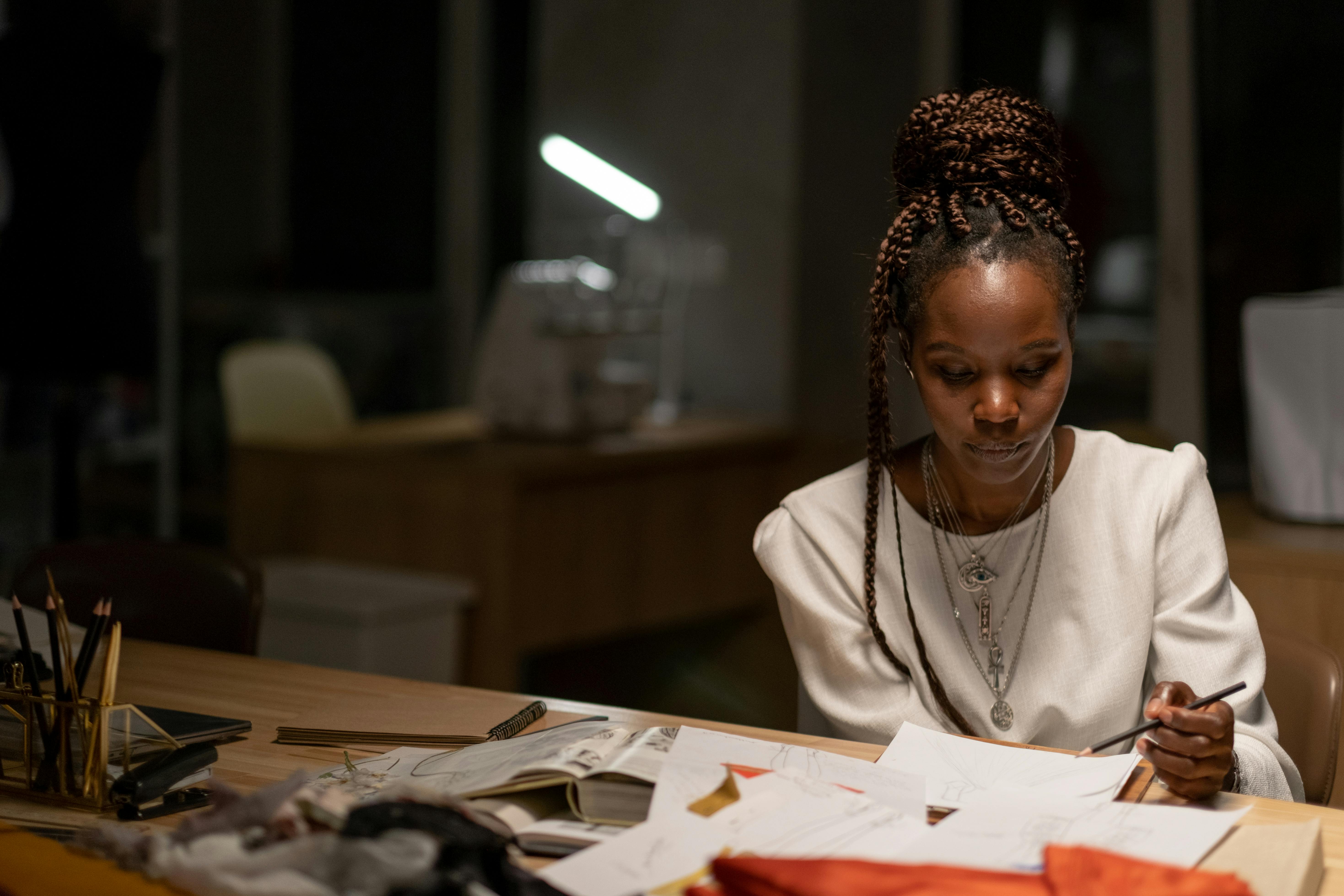 Fashion Designer Sitting at Her Workspace