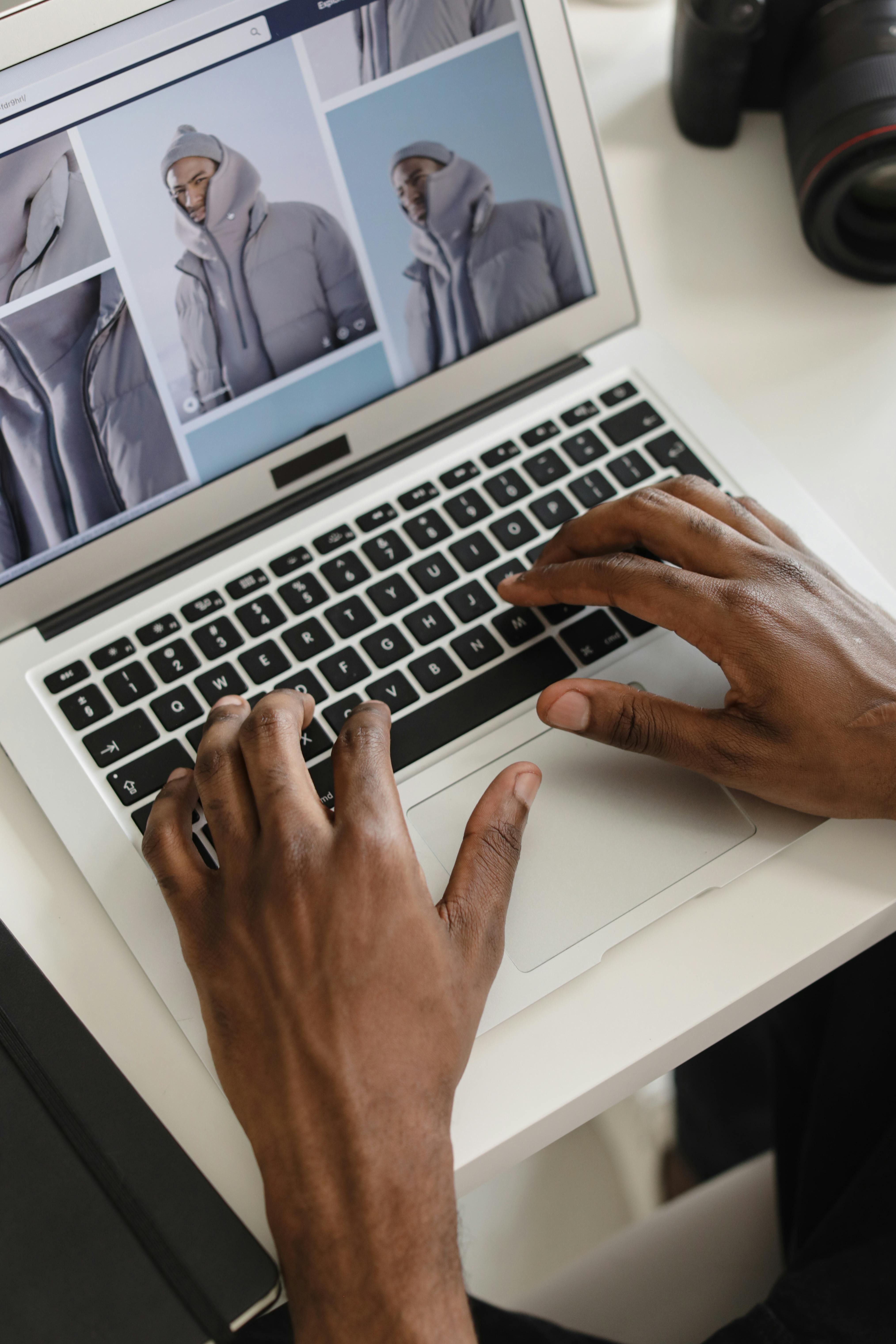 Close Up Photo of a Person Using a Laptop