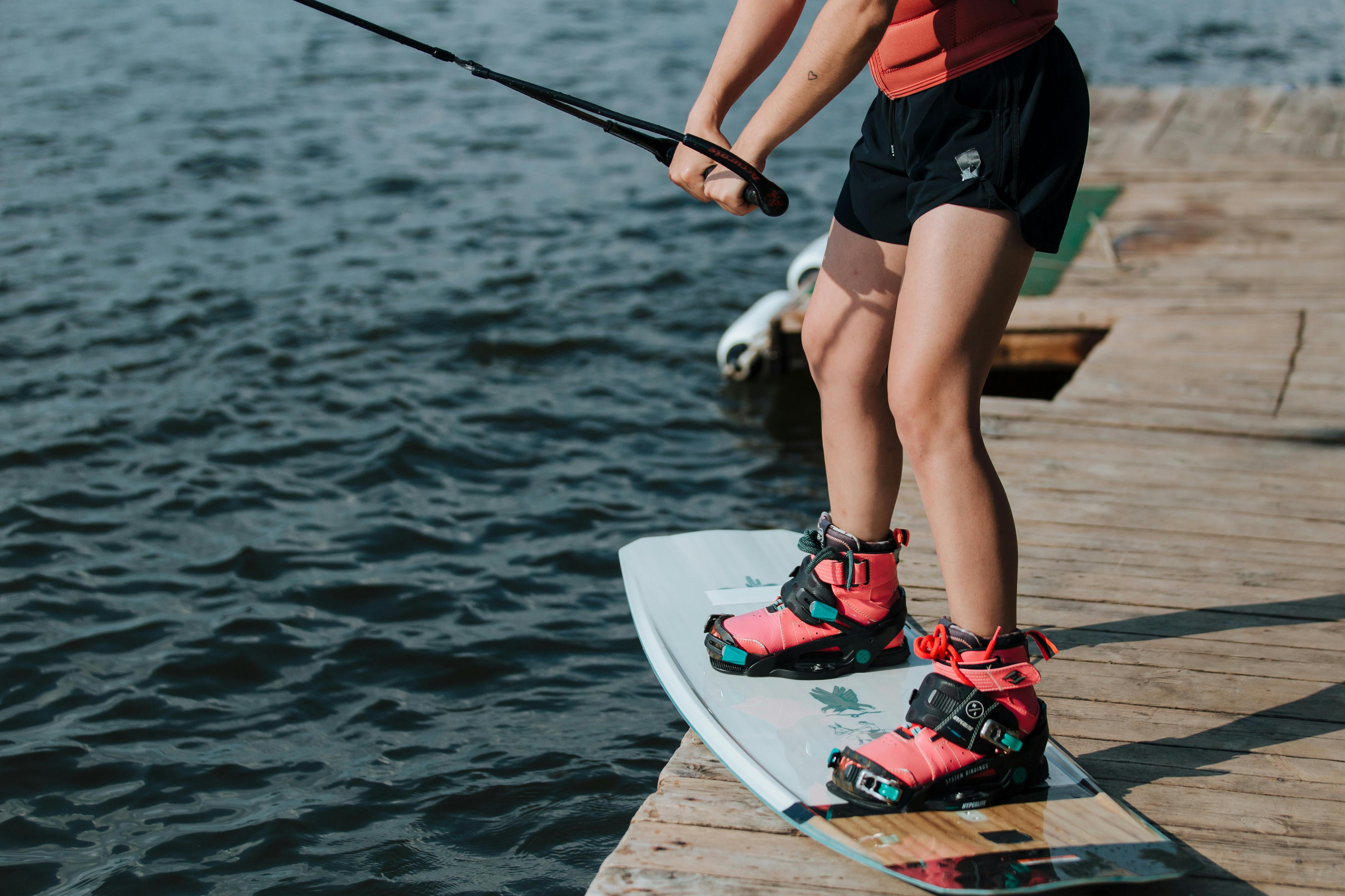 Person on Wakeboard on Jetty