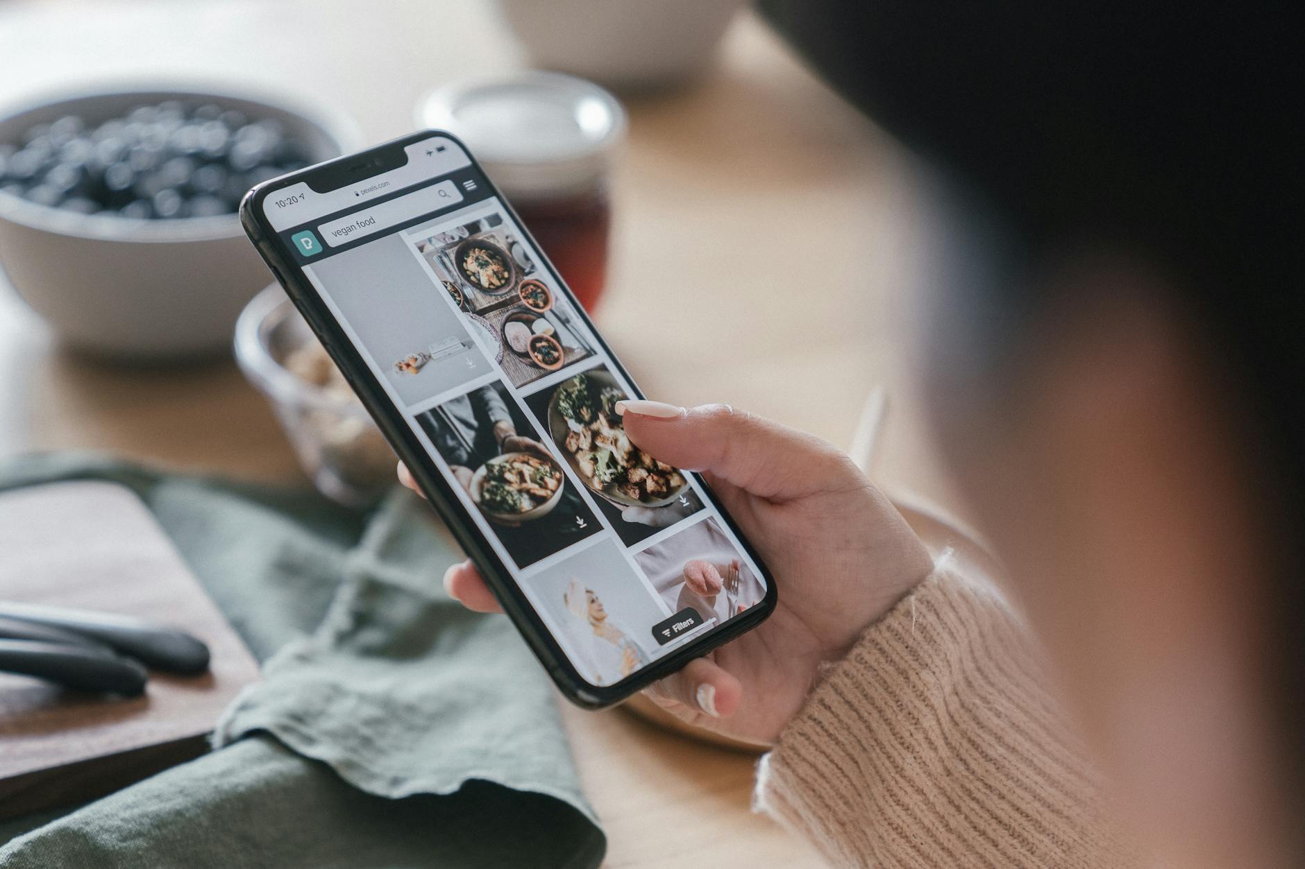 Close up Shot of a Person Looking at Photos on a Smartphone