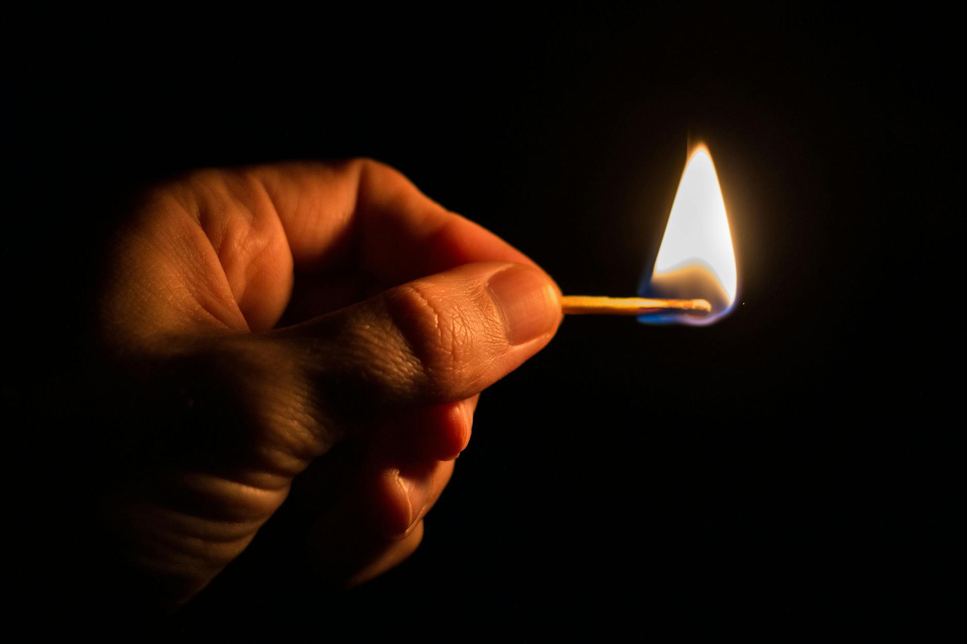 Person Holding Match Stick