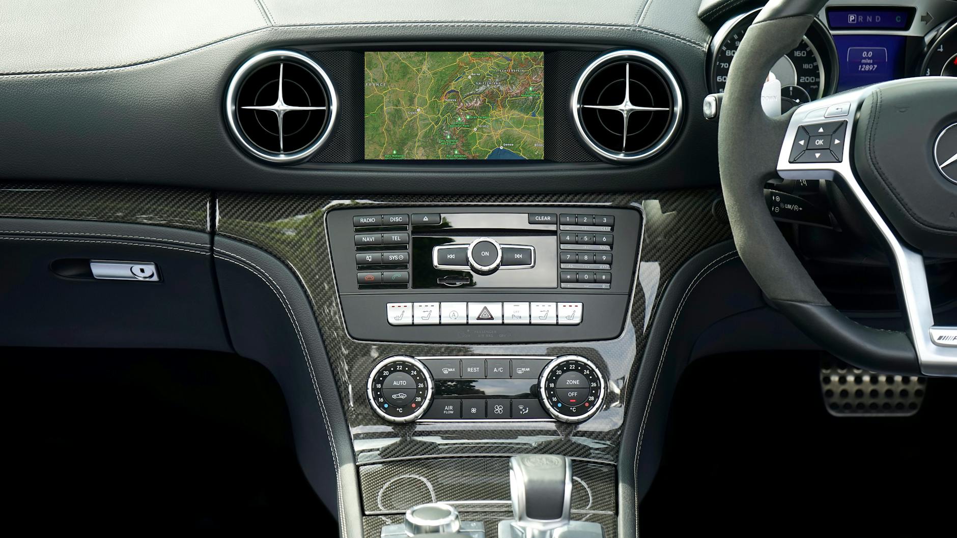 A well-designed transmission control system in front of a backdrop of a sleek modern interior.