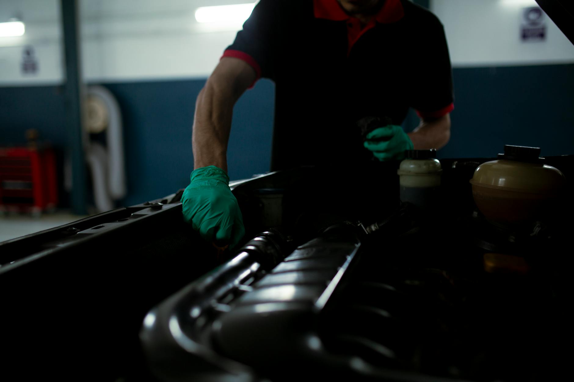 Mechanic Working with Car Engine