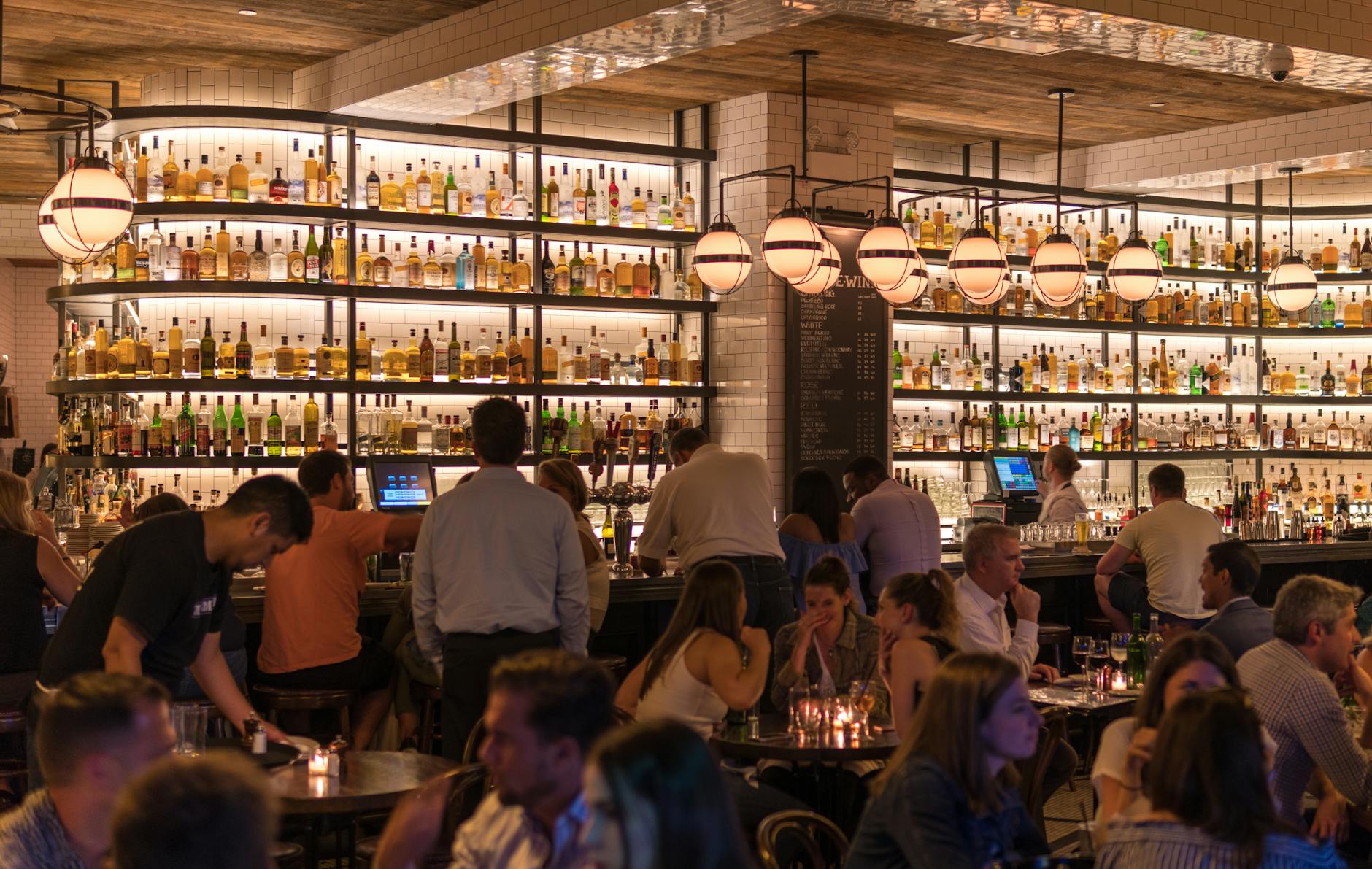 Group of People Gathering Inside a Bar