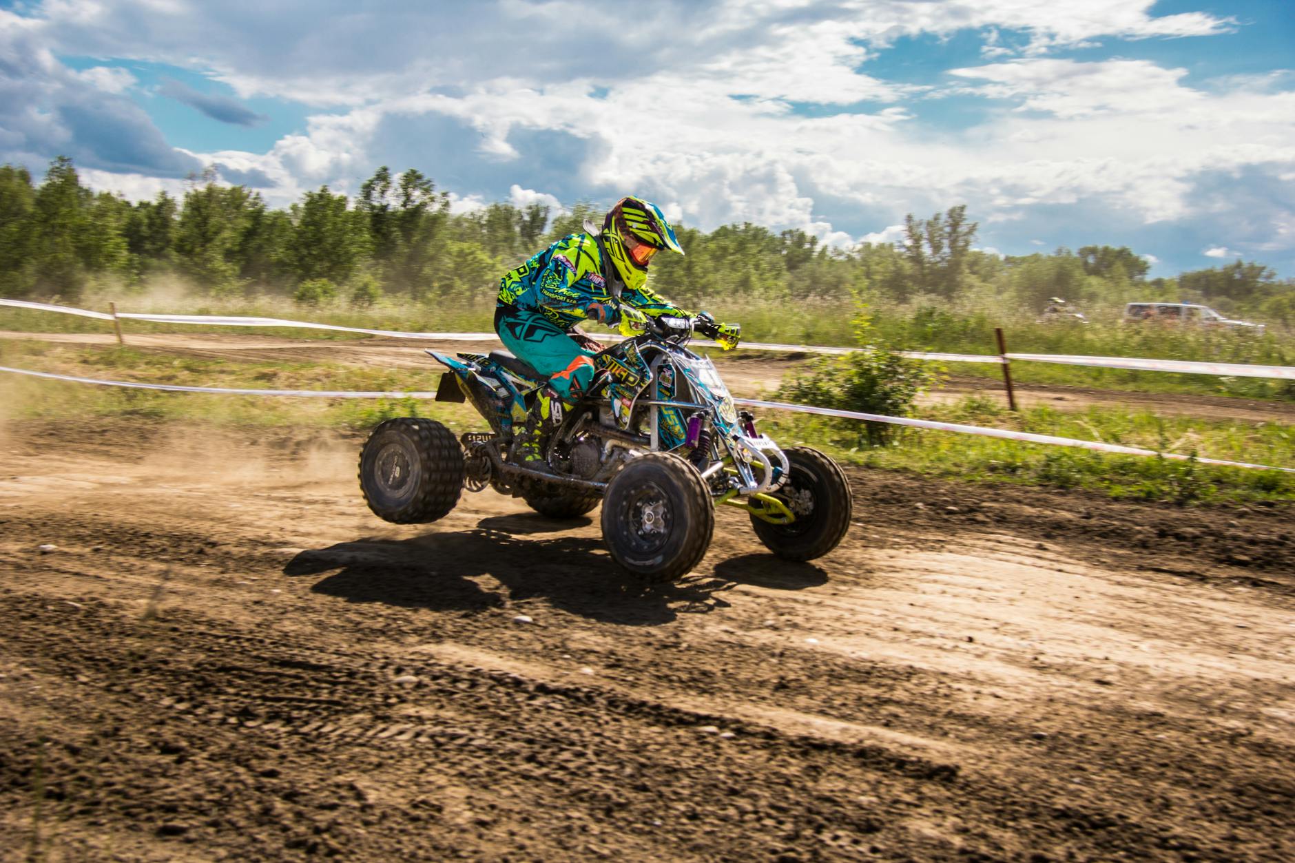 Person Riding ATV Under Sunny Sky