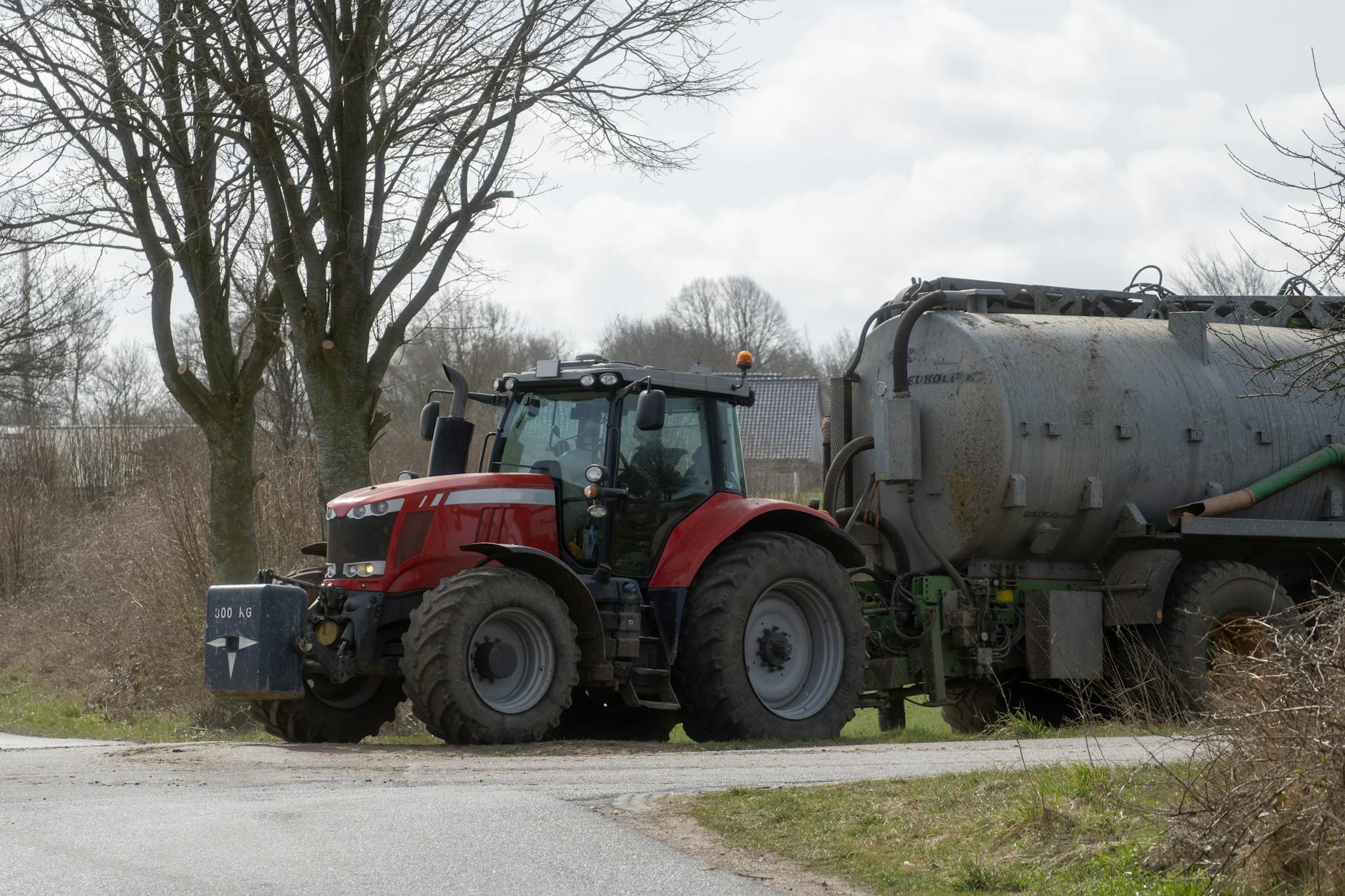 Massey Ferguson tractor towing a slurry tanker