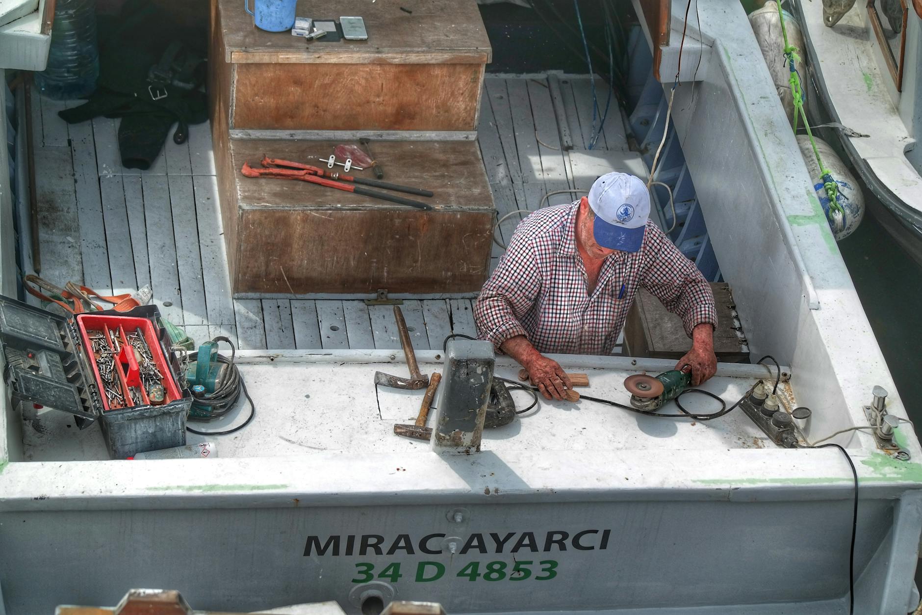 Man Working on Boat Deck