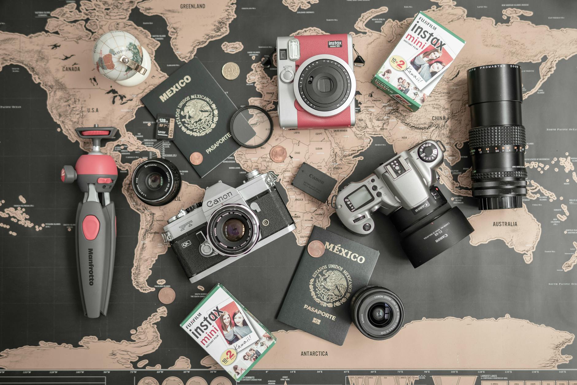 Vintage Canon Cameras and Lens on a Map Table