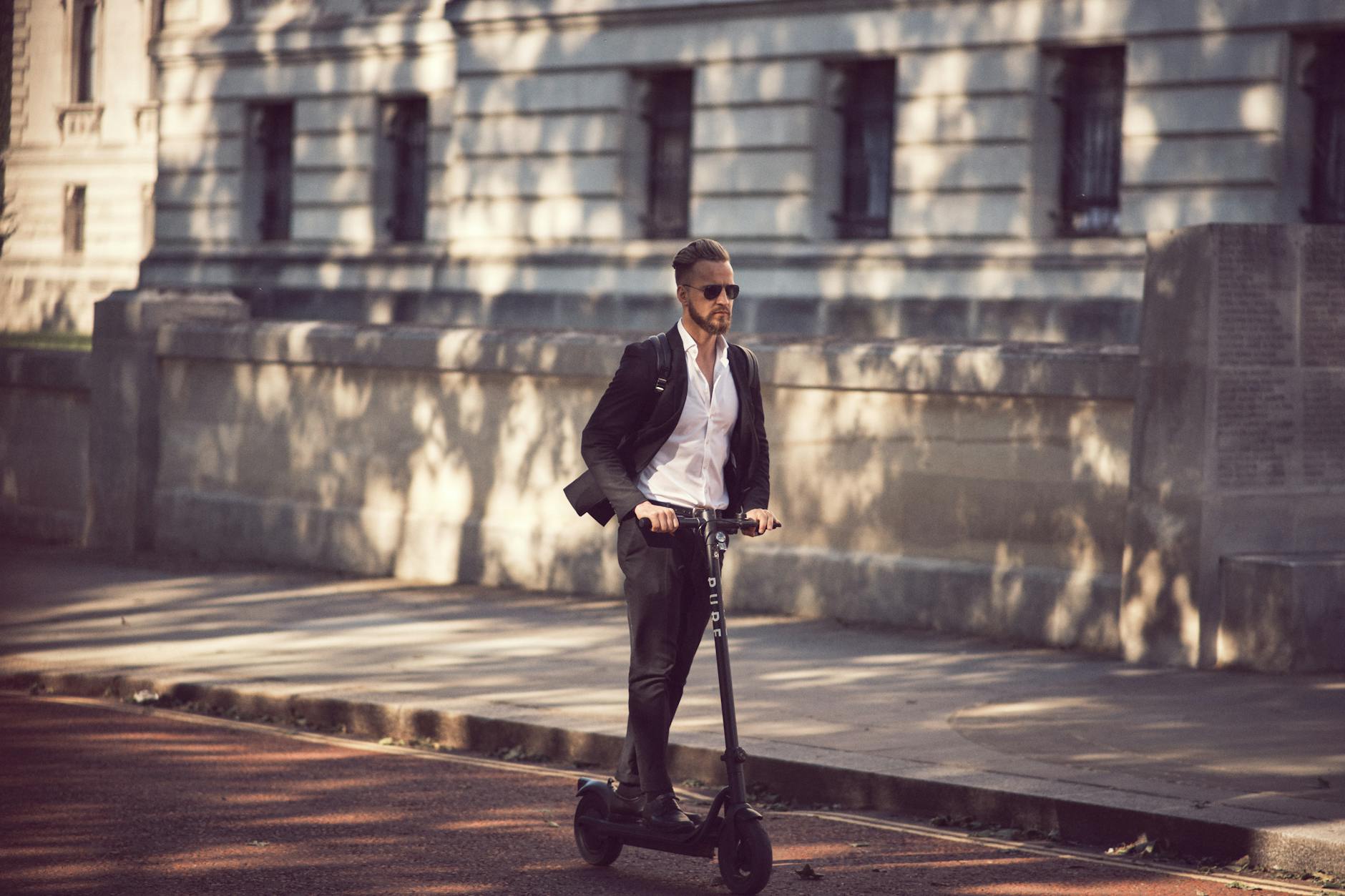 Photo of a Man on an Electric Scooter