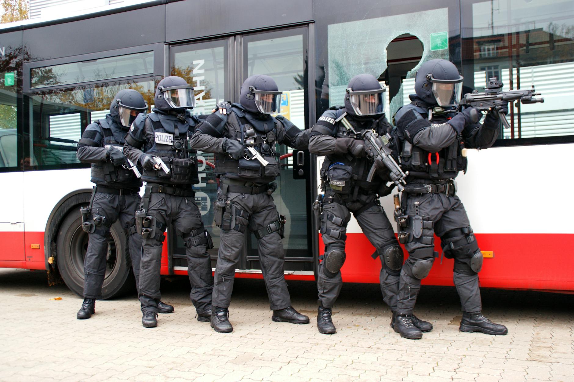 Police SWAT Team Excercising a Hostage Rescue Scenario Involving a Bus