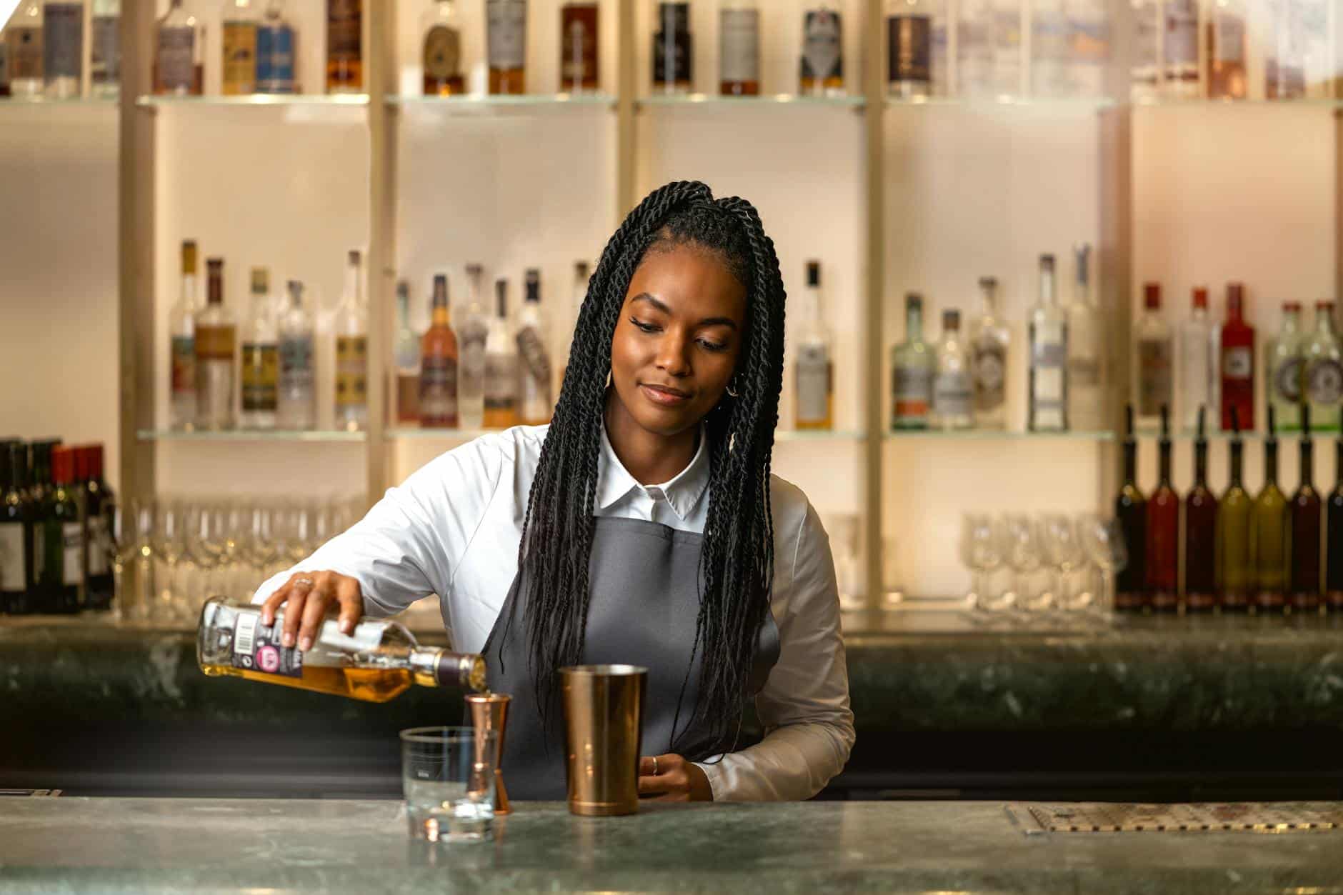 Barmaid Pouring Alcohol