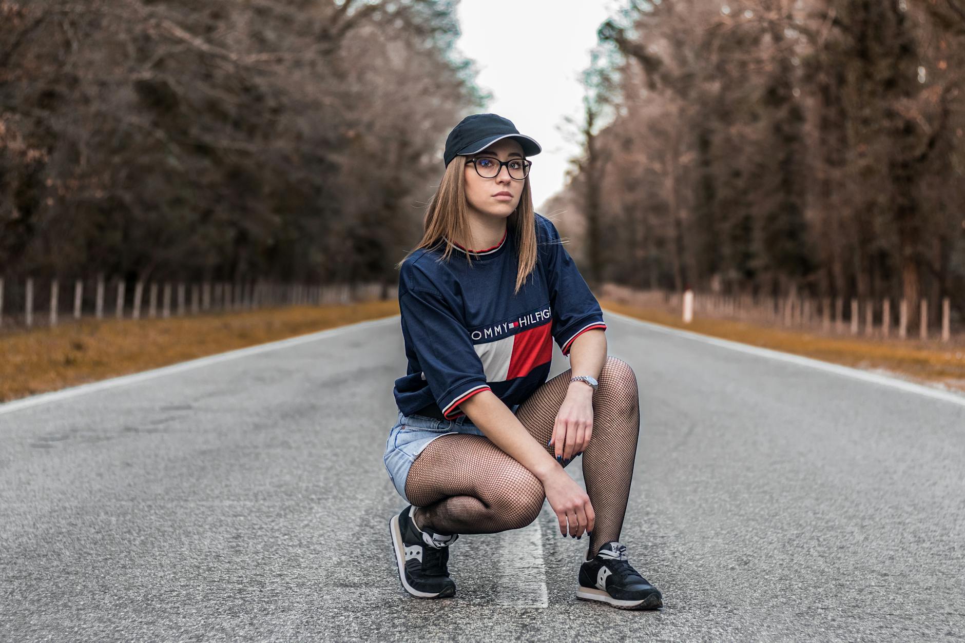 Woman Posing In The Middle Of The Road