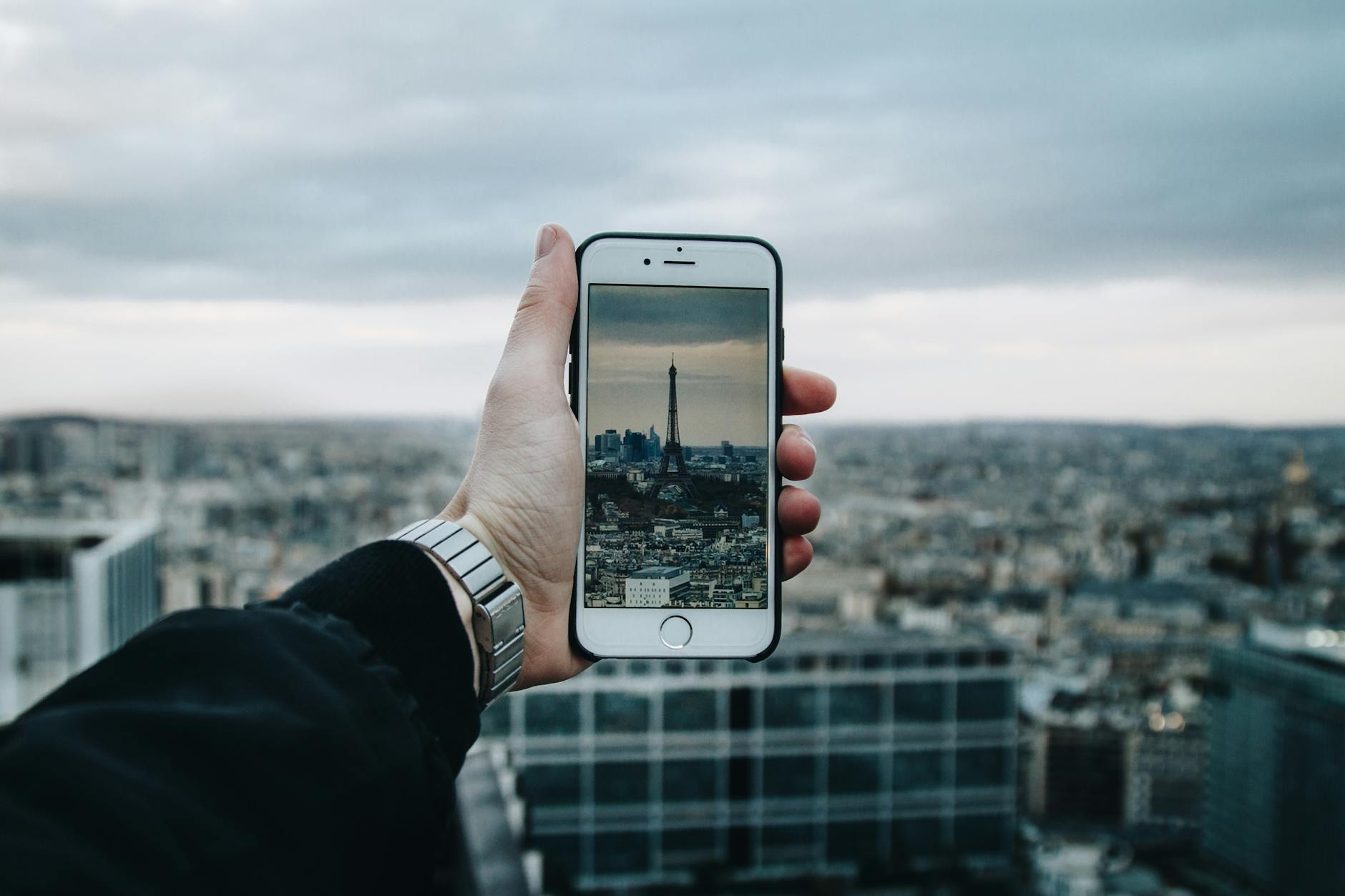 Man Taking Picture Of The City