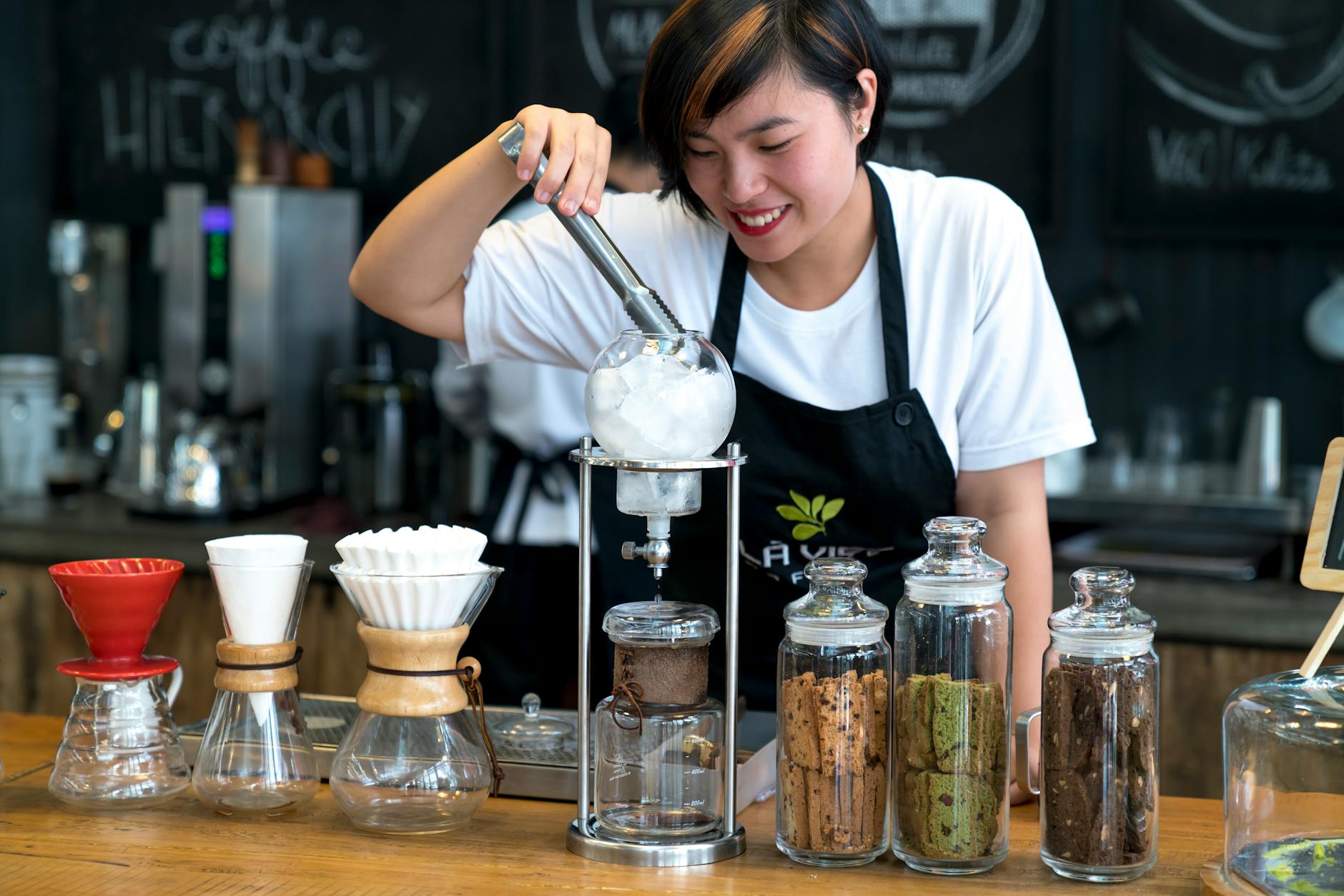 A Woman Preparing Ice Cream in Bar