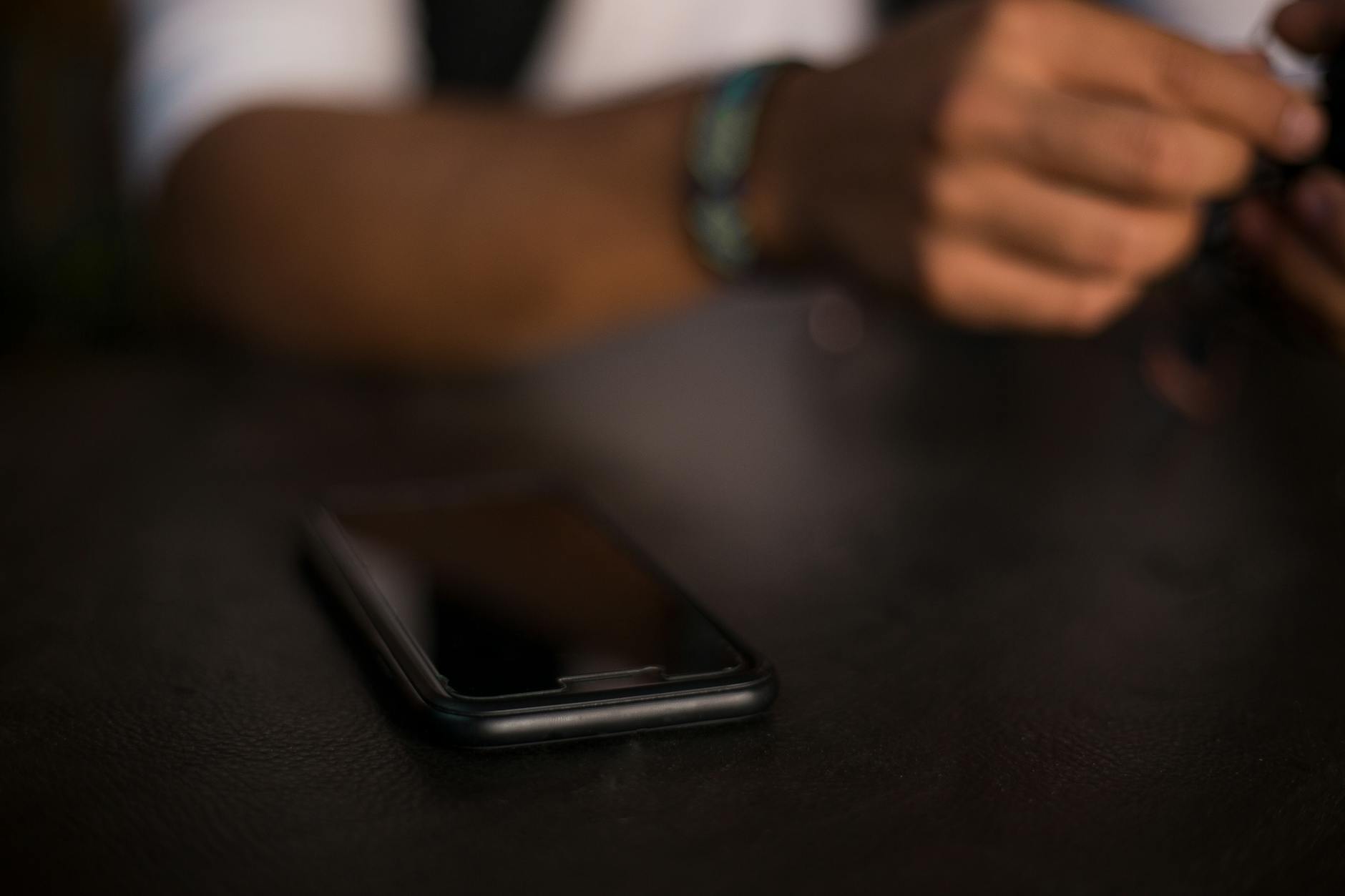 Black iPhone on Table