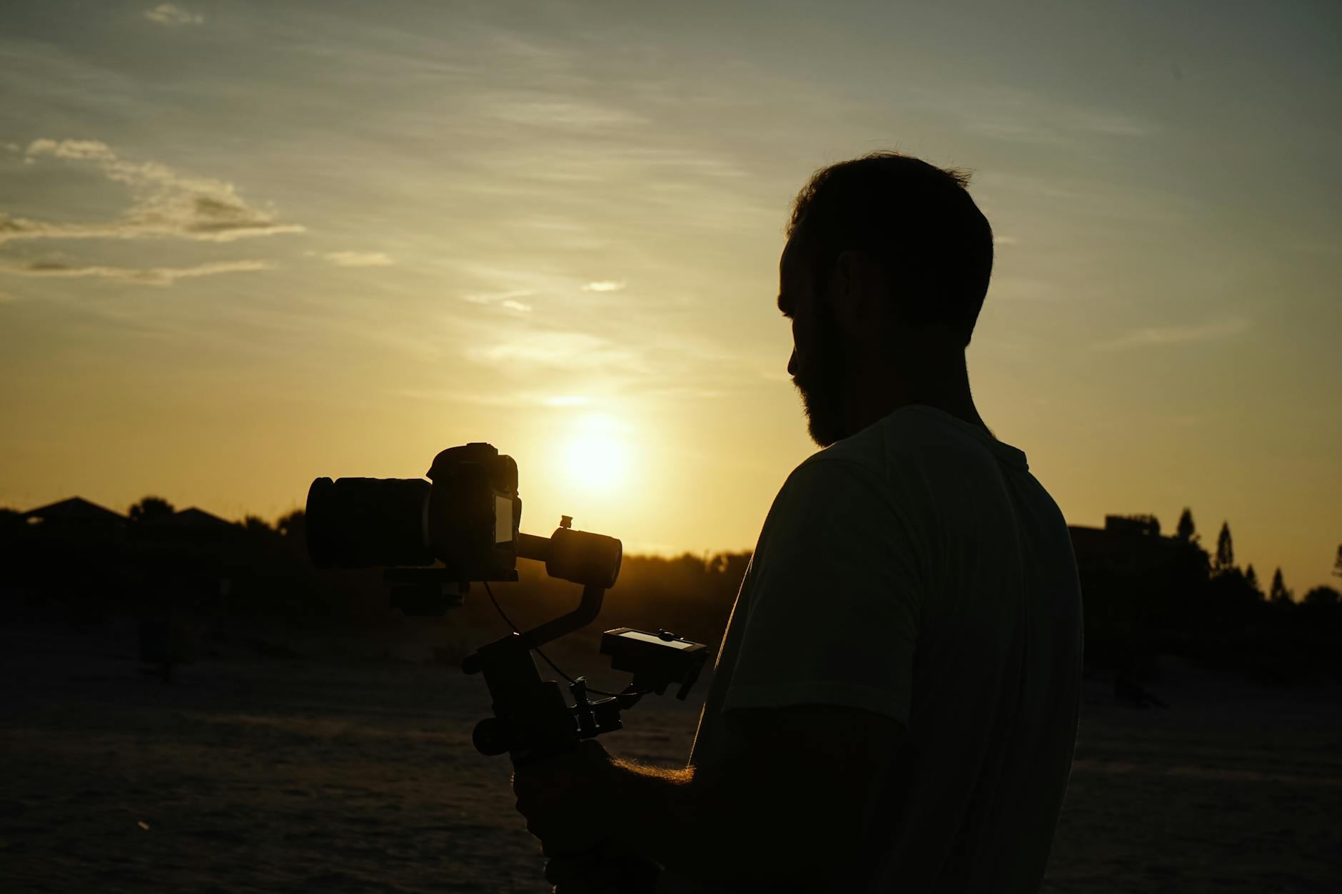 A professional videographer setting up equipment for a shoot