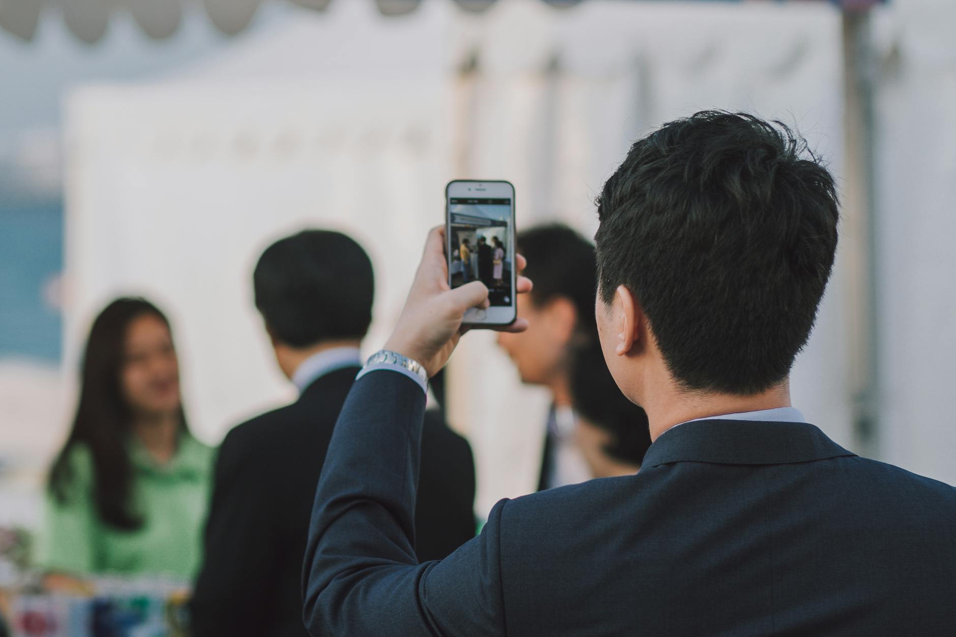 Man Taking Picture on People