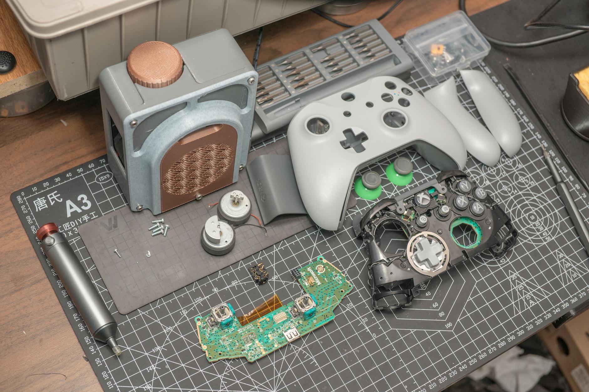 Disassembled Xbox Controller on Desk Mat