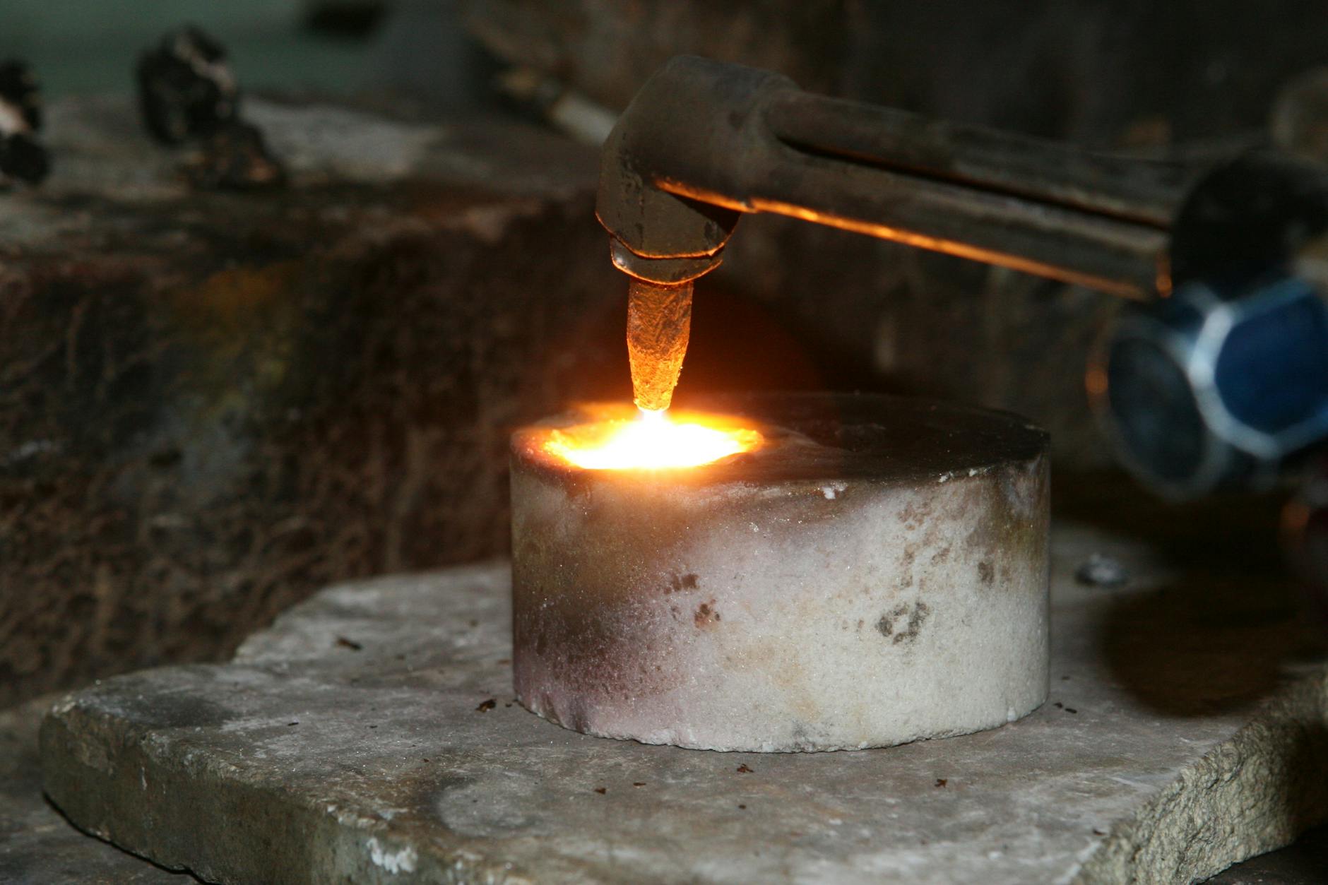 Selective Focus Photography of Welding Torch on Concrete Round Bar