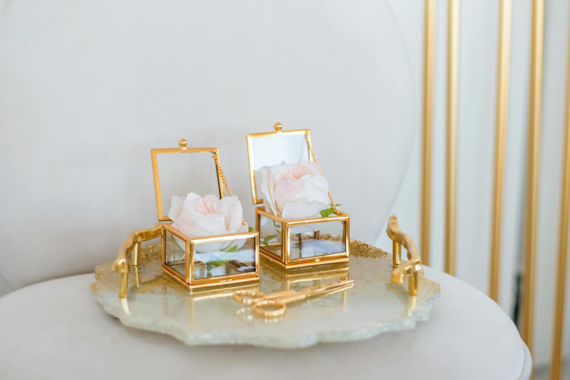 Boxes with Roses and Scissors on Tray on Table