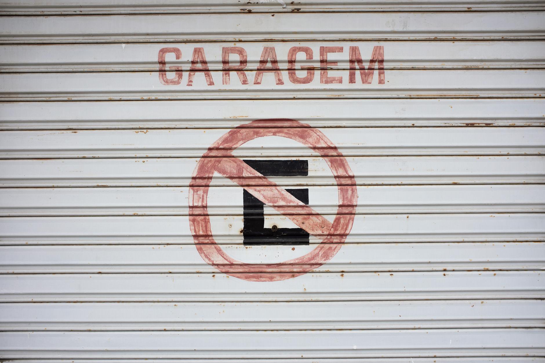 Garage door with no parking sign