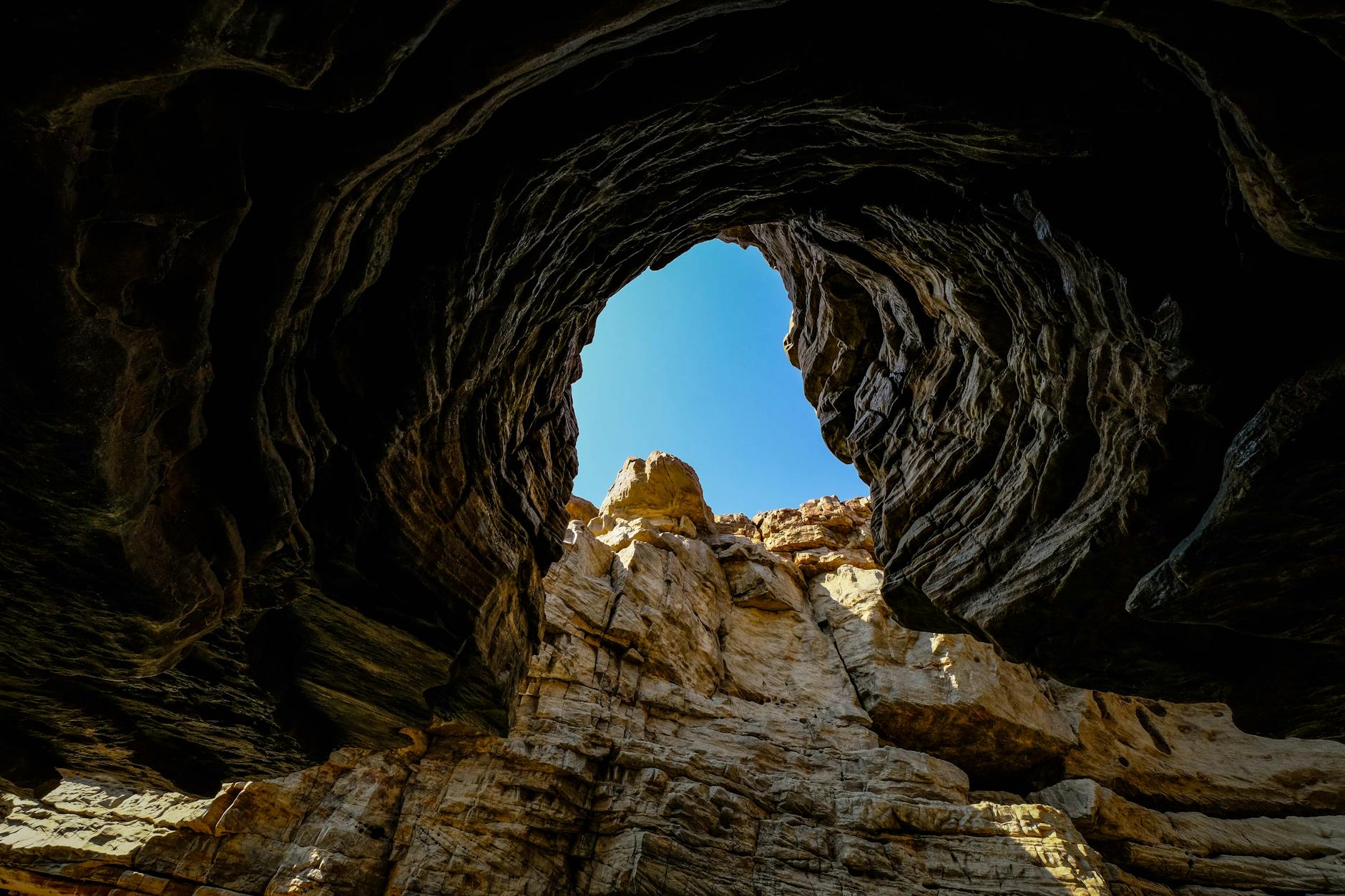 A view of a cave with a hole in it